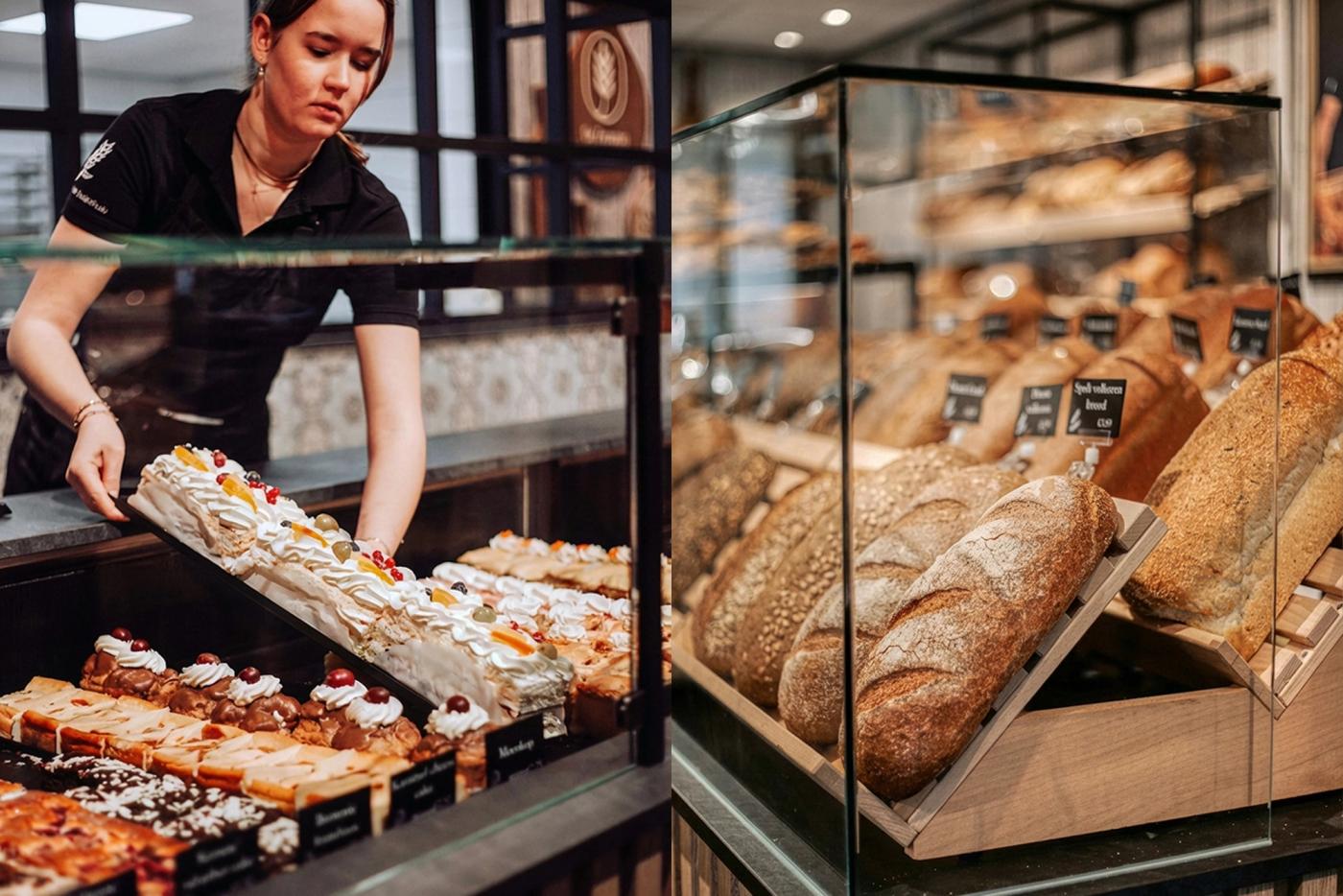 Medewerker vult de gebaksvitrine bij De Zeeuwse Bakclub, naast een presentatie van ambachtelijk brood.
