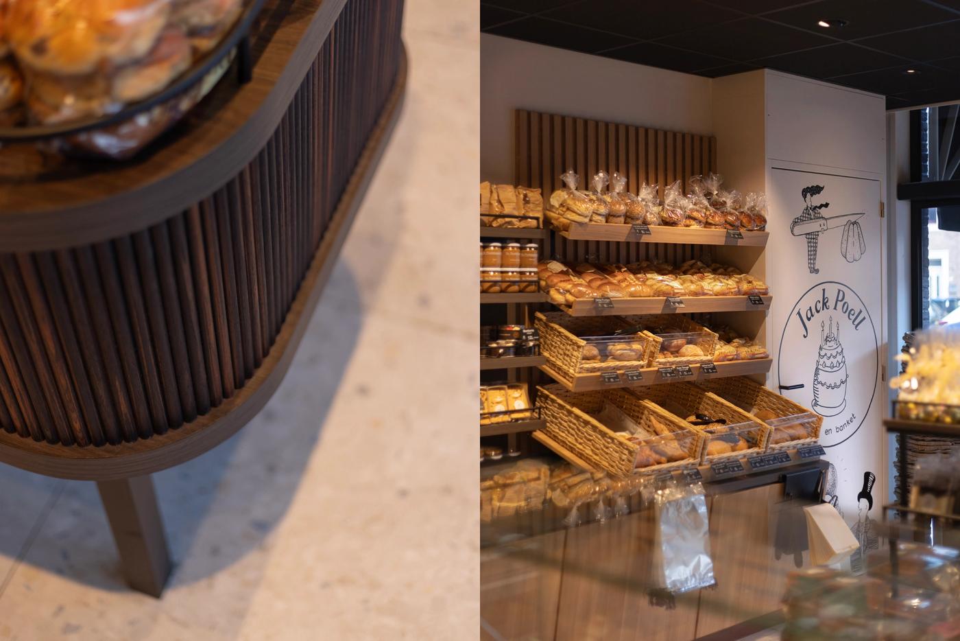 Detail van het winkelinterieur van Bakkerij Jack Poell in Eindhoven, met afgerond maatwerkmeubilair, warme houten latten, ambachtelijke broodpresentatie en karakteristieke bakkerijillustraties.