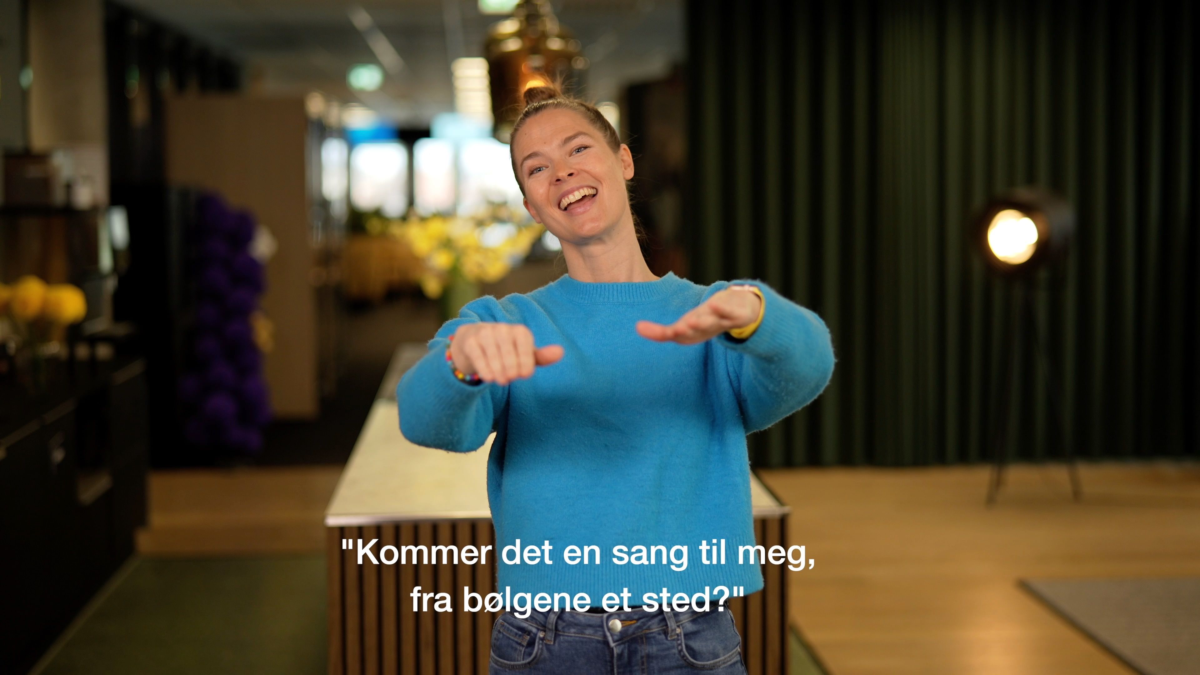"Som bølger" med tegnsang