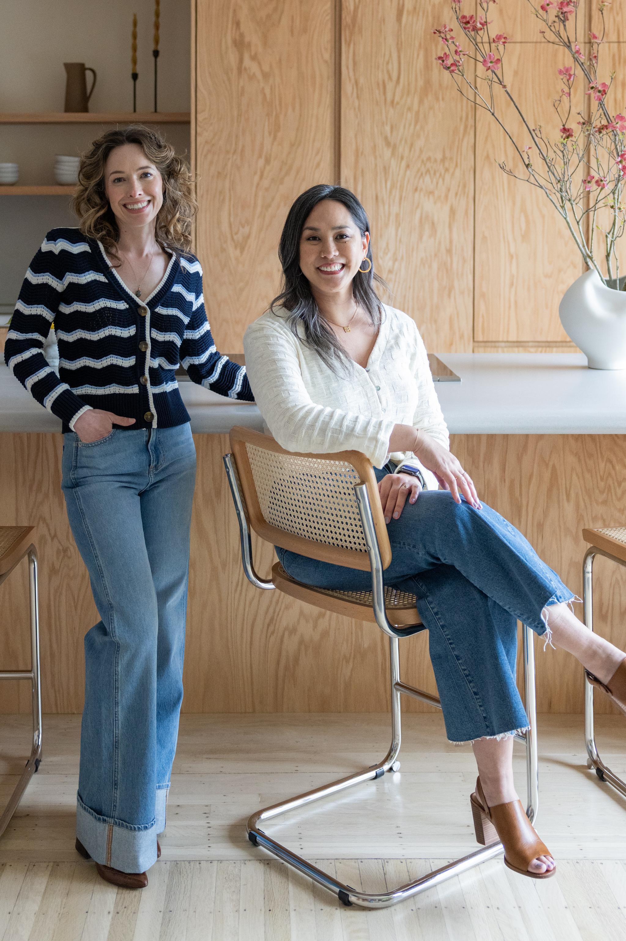 Studio VAE principals Veronica Jurist and Aggie Revane in a red oak kitchen in San Francisco