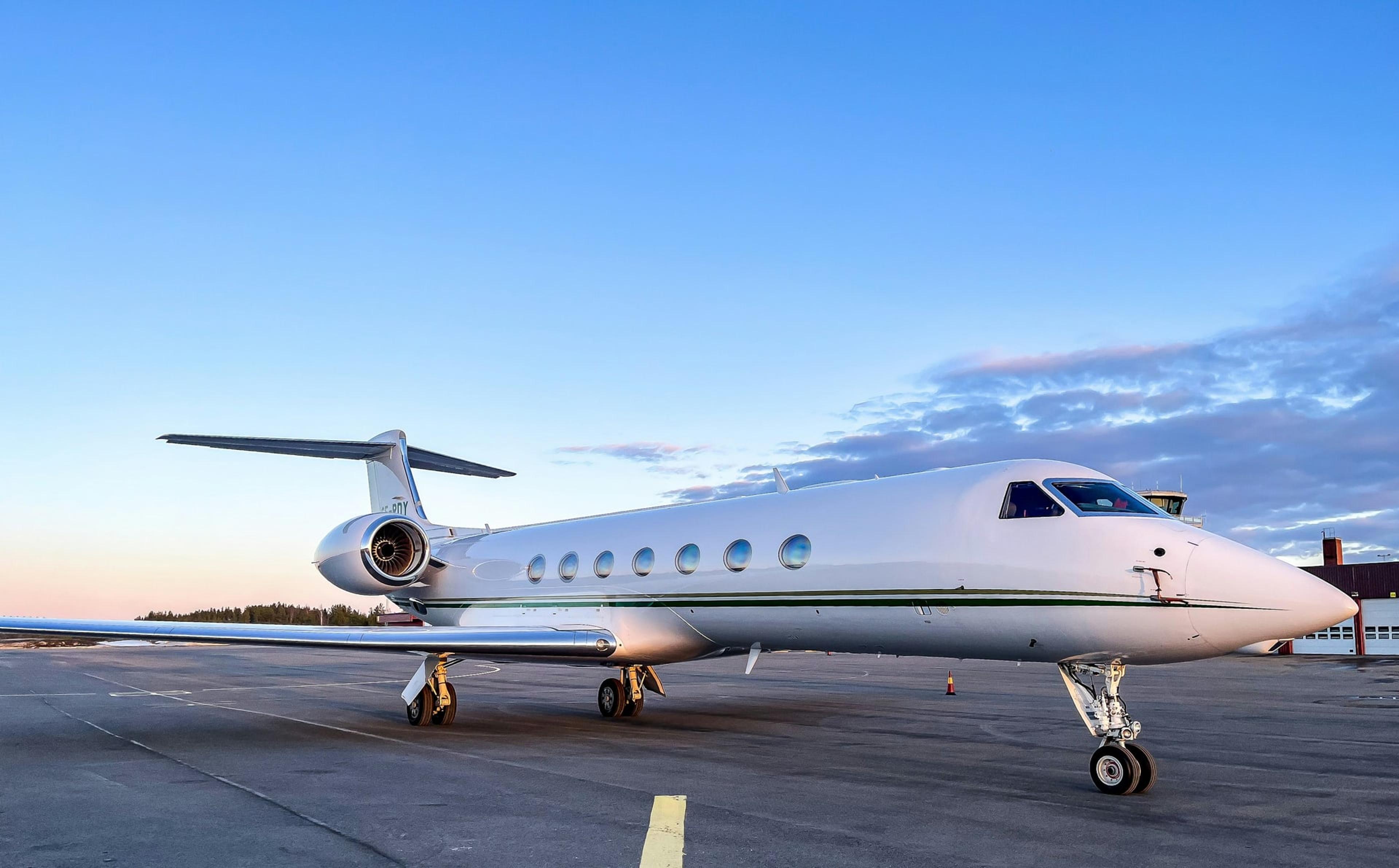 Private jet on the tarmac at golden hour