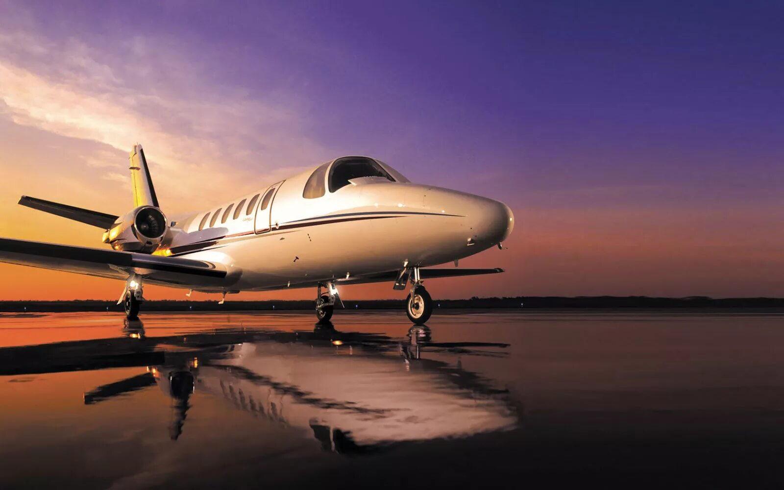 Private jet exterior at sunrise