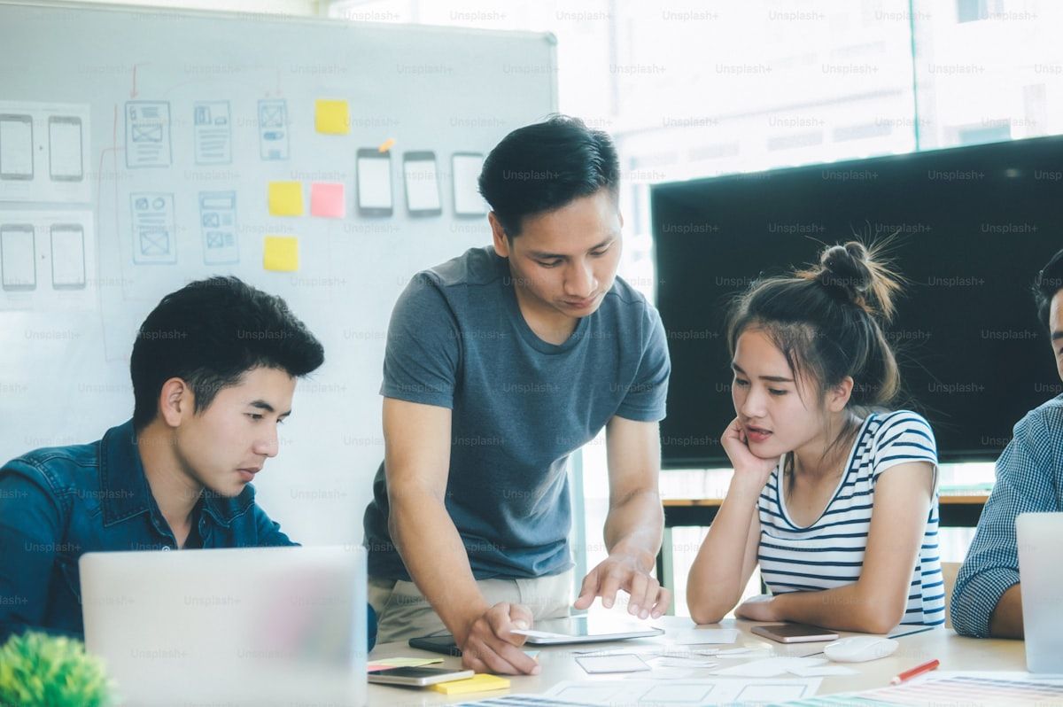 UX UI designer and programmer planning a mobile application with wireframes and prototypes