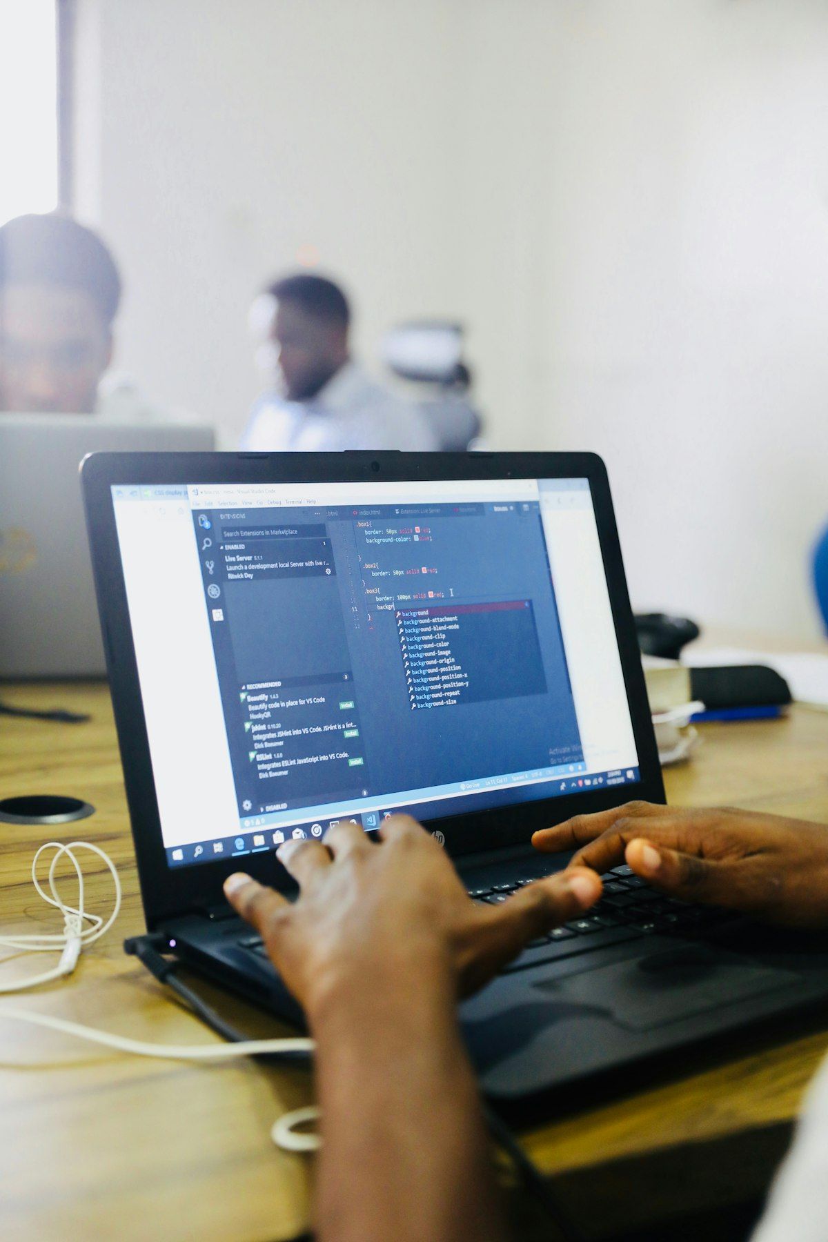 Developer using a laptop computer for software coding