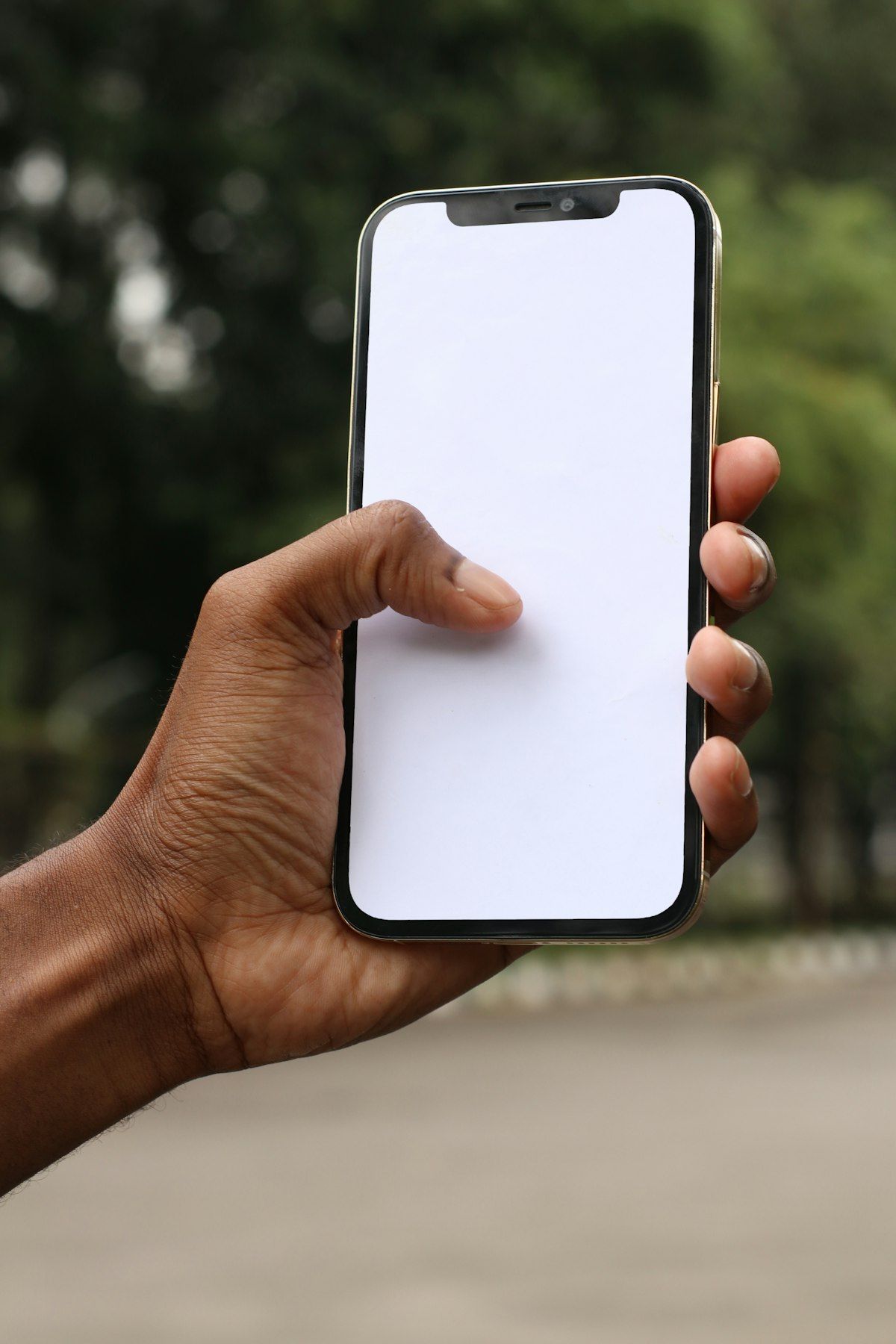 Person holding a smartphone showcasing a modern mobile application interface