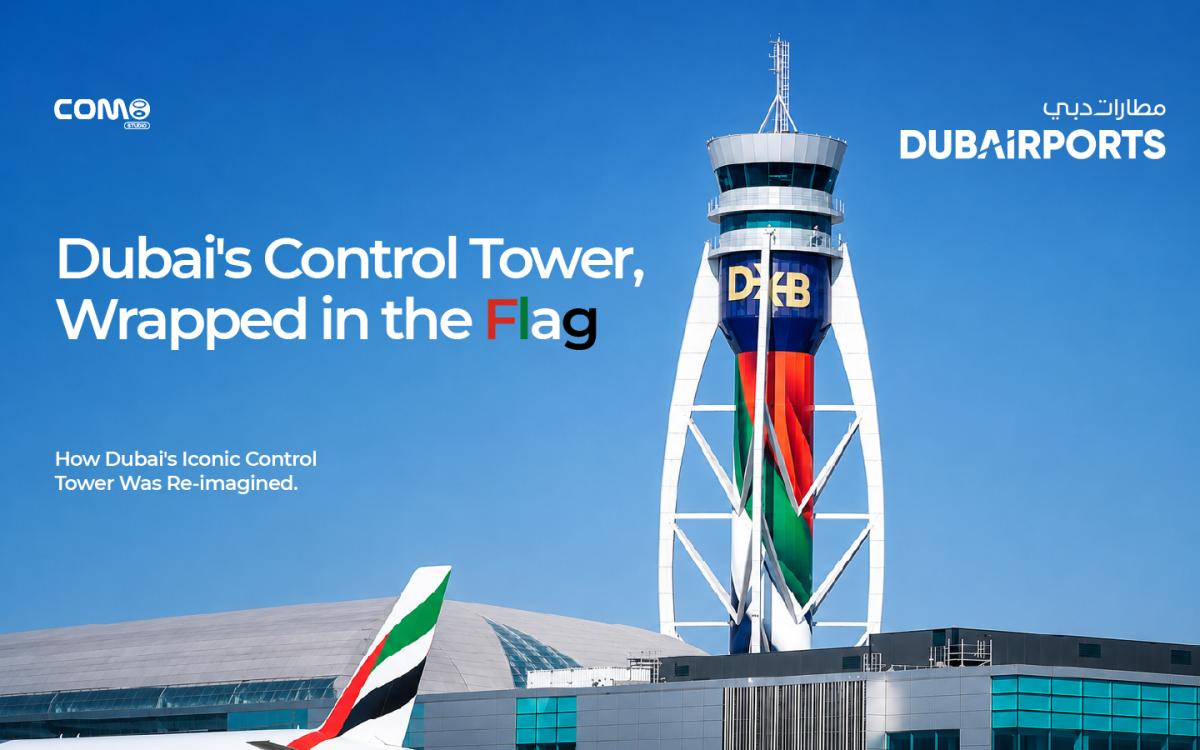 The DXB airport control tower wrapped in the UAE flag, designed by COM8 STUDIO.