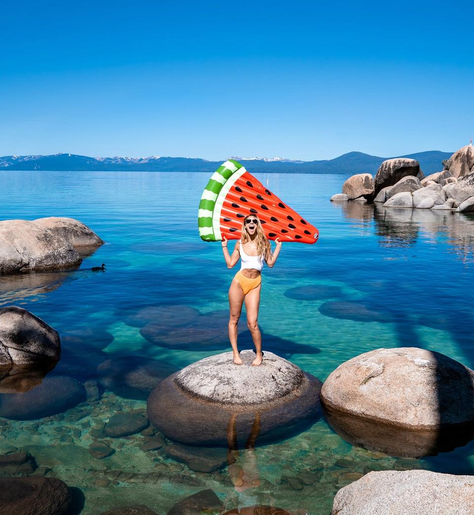 Woman with pool floaty in Lake Tahoe
