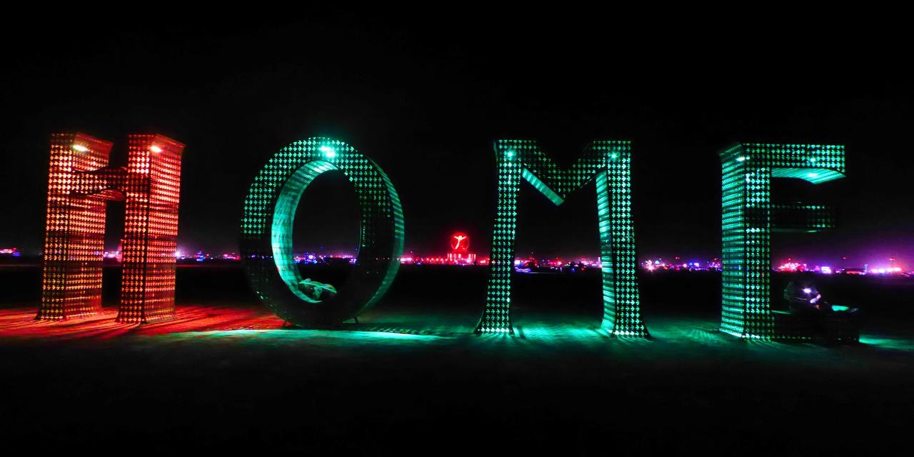 Letter statue spelling 'home' at Burning Man.