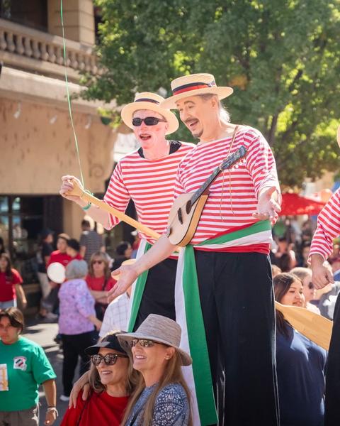 Stilt walkers at the Great Italian Festival