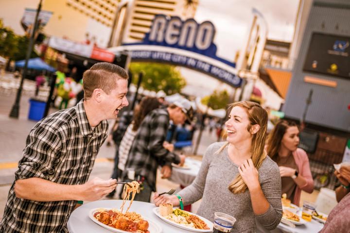 Couple eating dinner at the Great Italian Festival