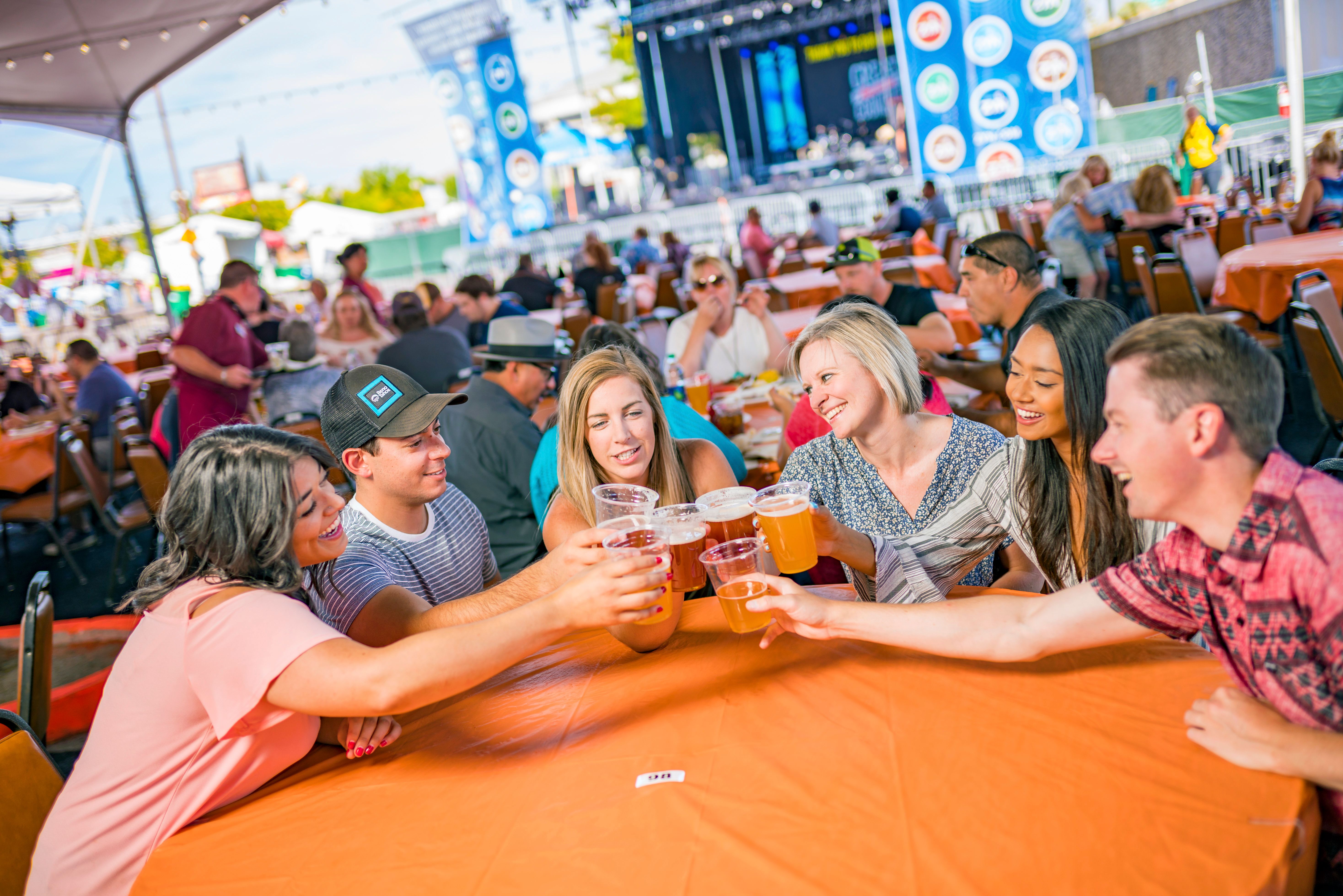 Group of friends toasting with beer.