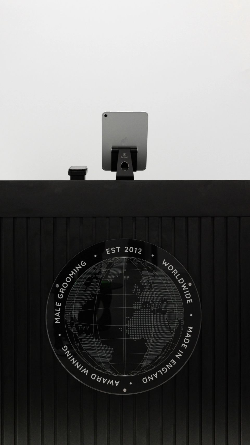 The MENSPIRE front desk badge: male grooming, worldwide, made in England, award winning