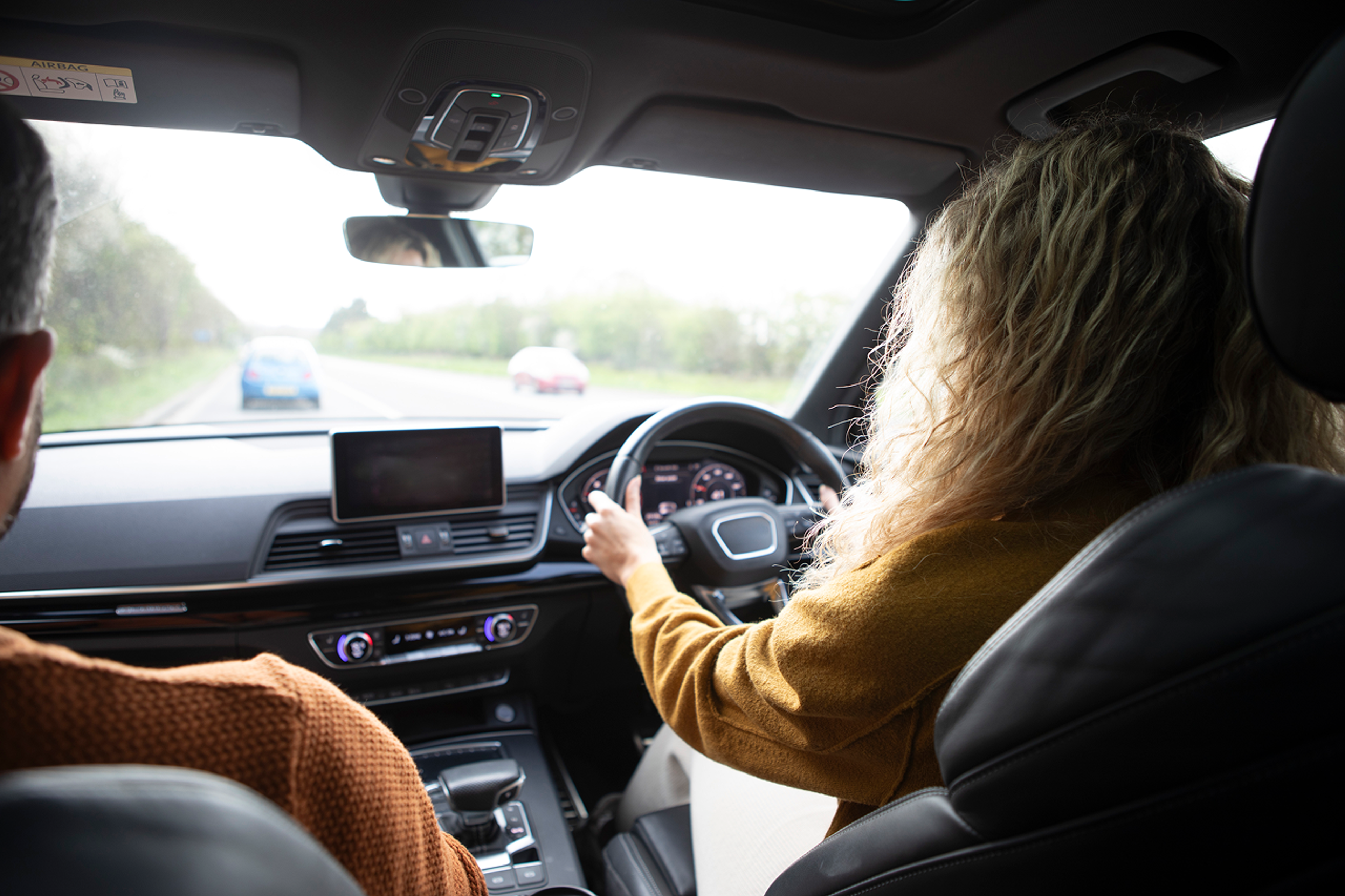 female driver on a driving lesson