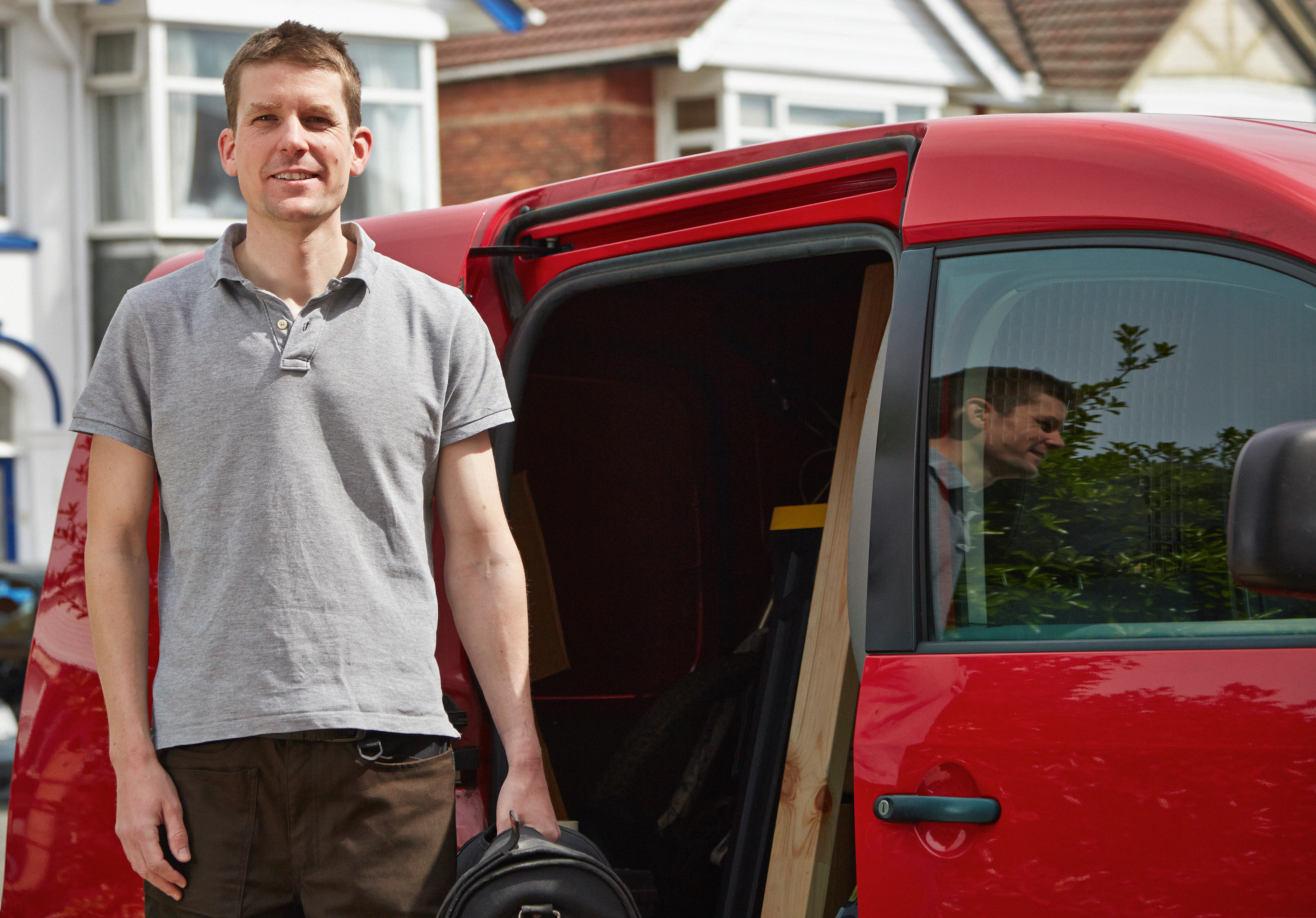 Driver stood outside of his van