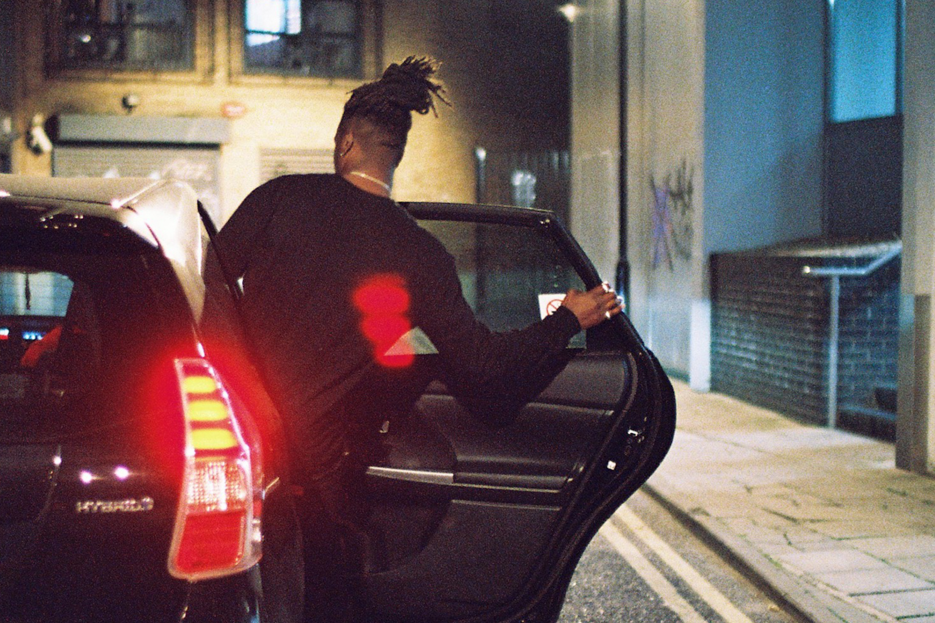 Passenger getting into a taxi