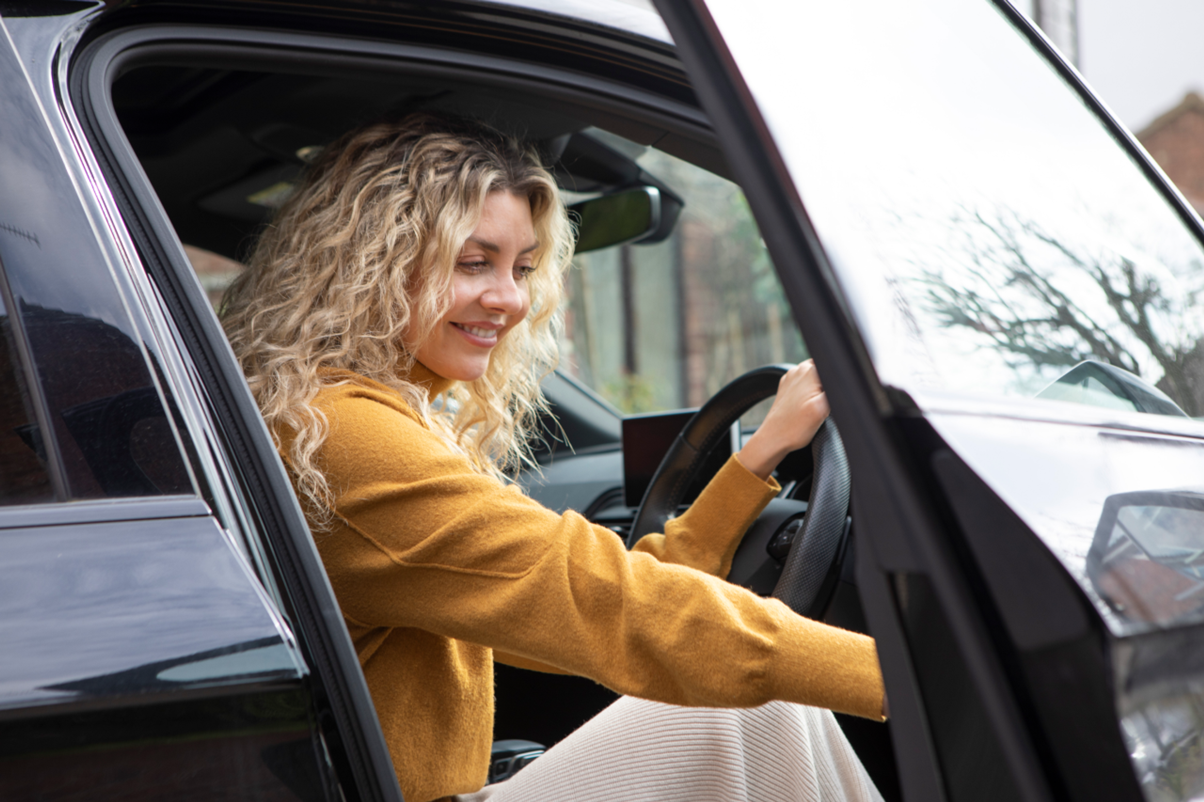 woman opening car door