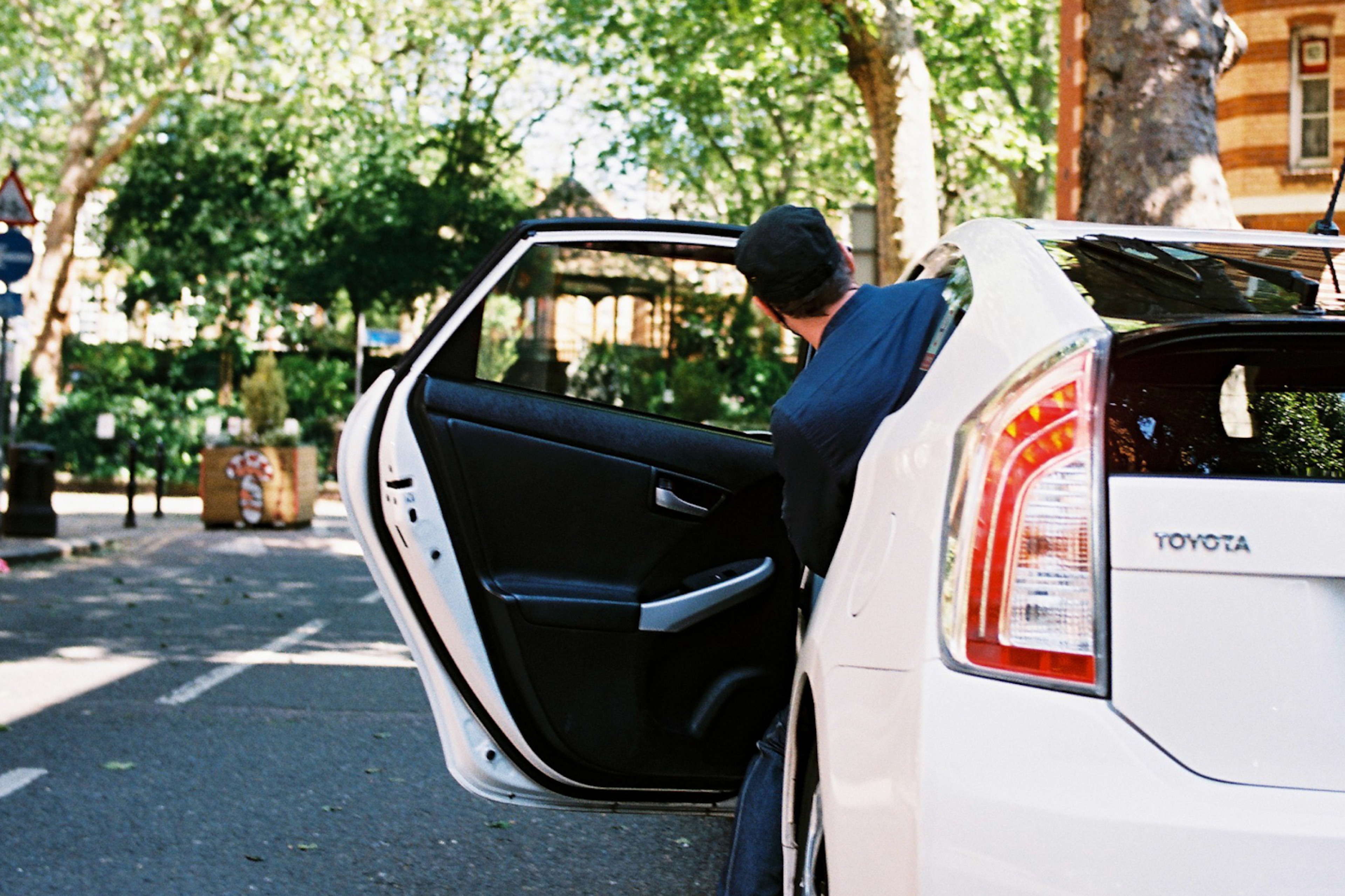 Drivers talking next to a car