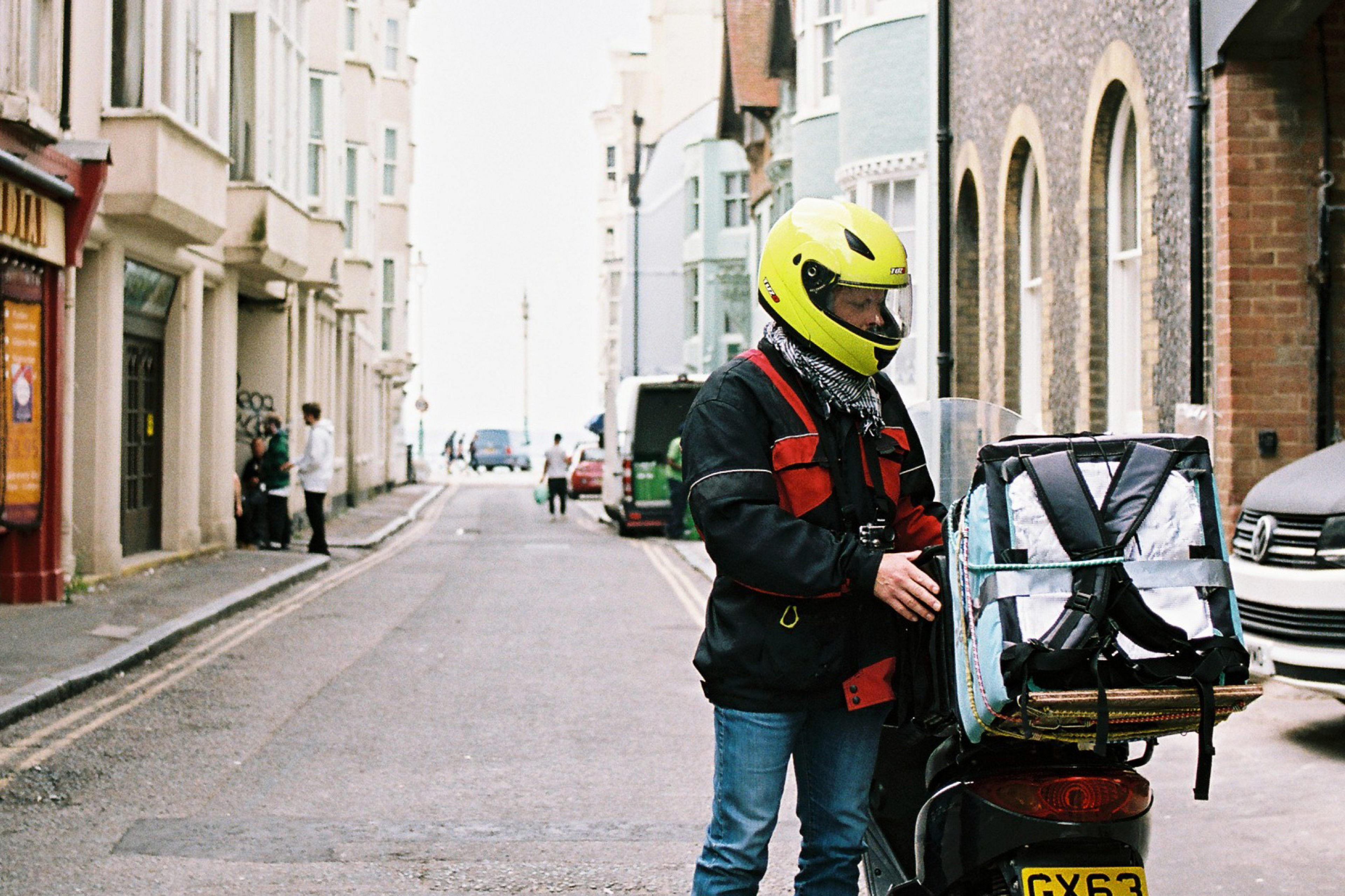Driver checking phone next to bike