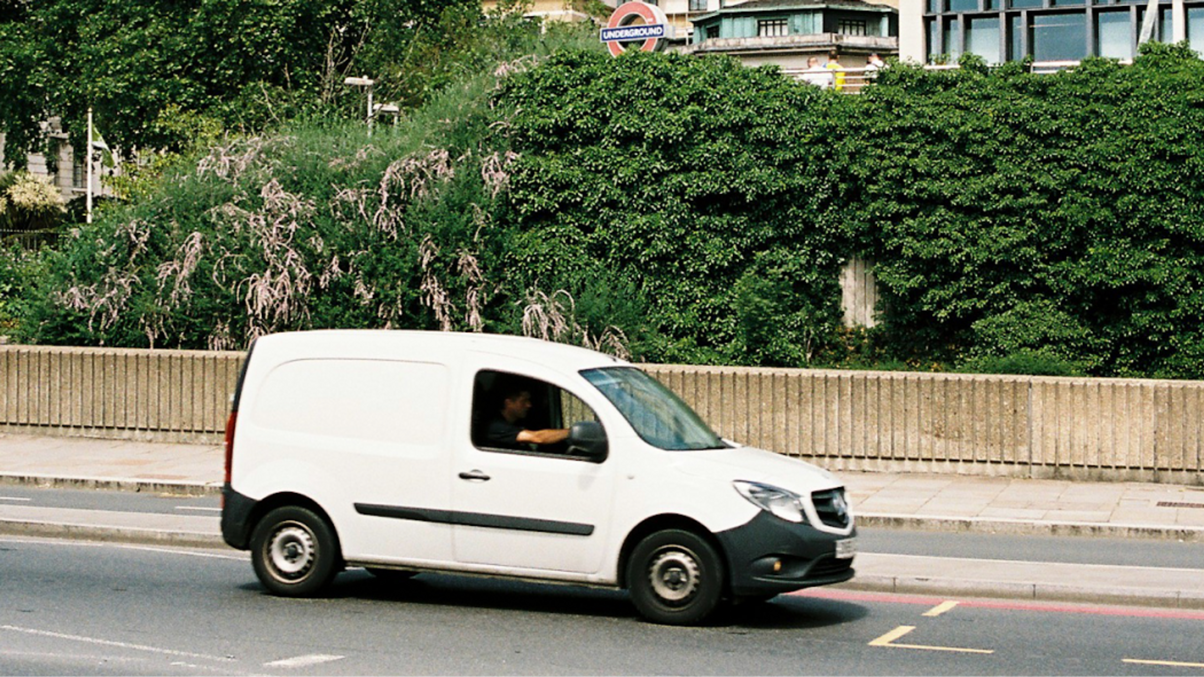 courier van driver in a white van