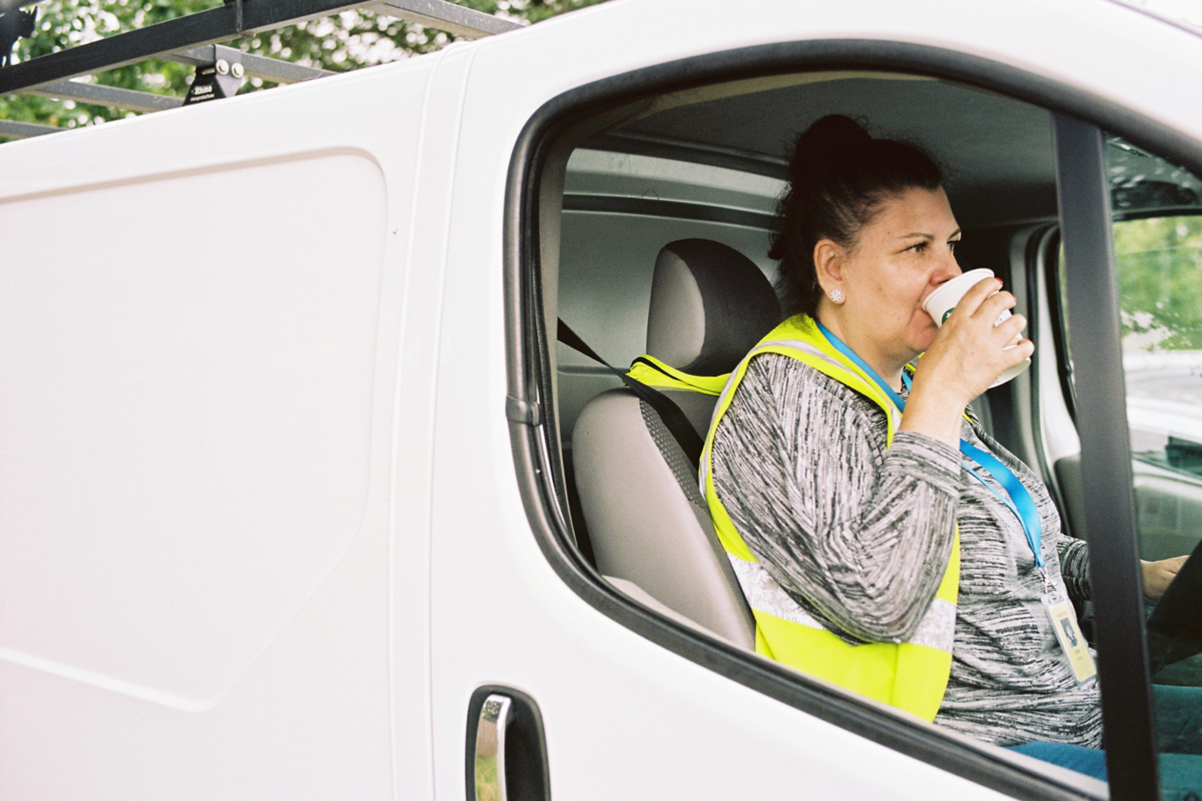 van driver drinking coffee