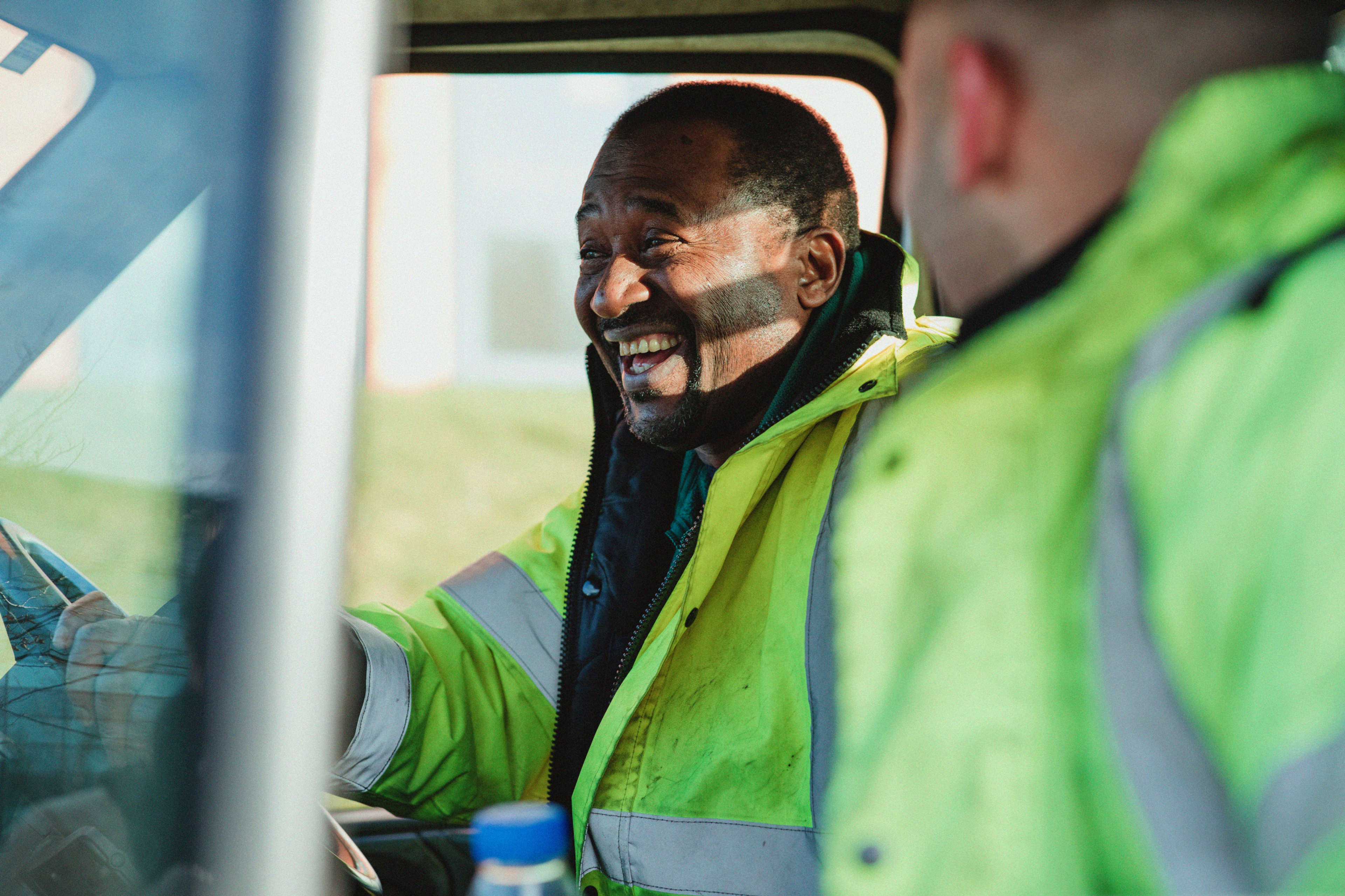 Van driver in high vis jacket