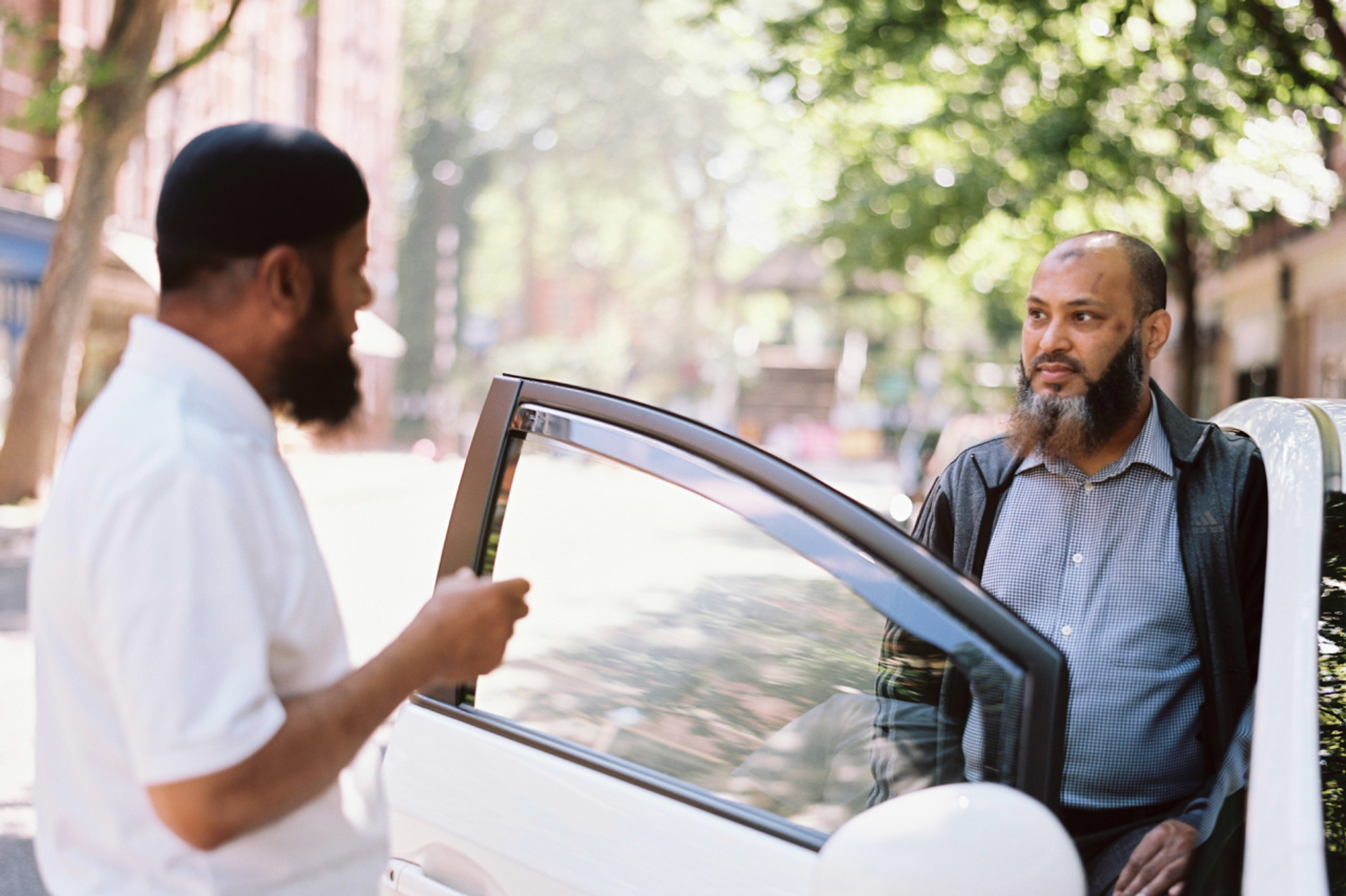 two private hire taxi drivers chatting