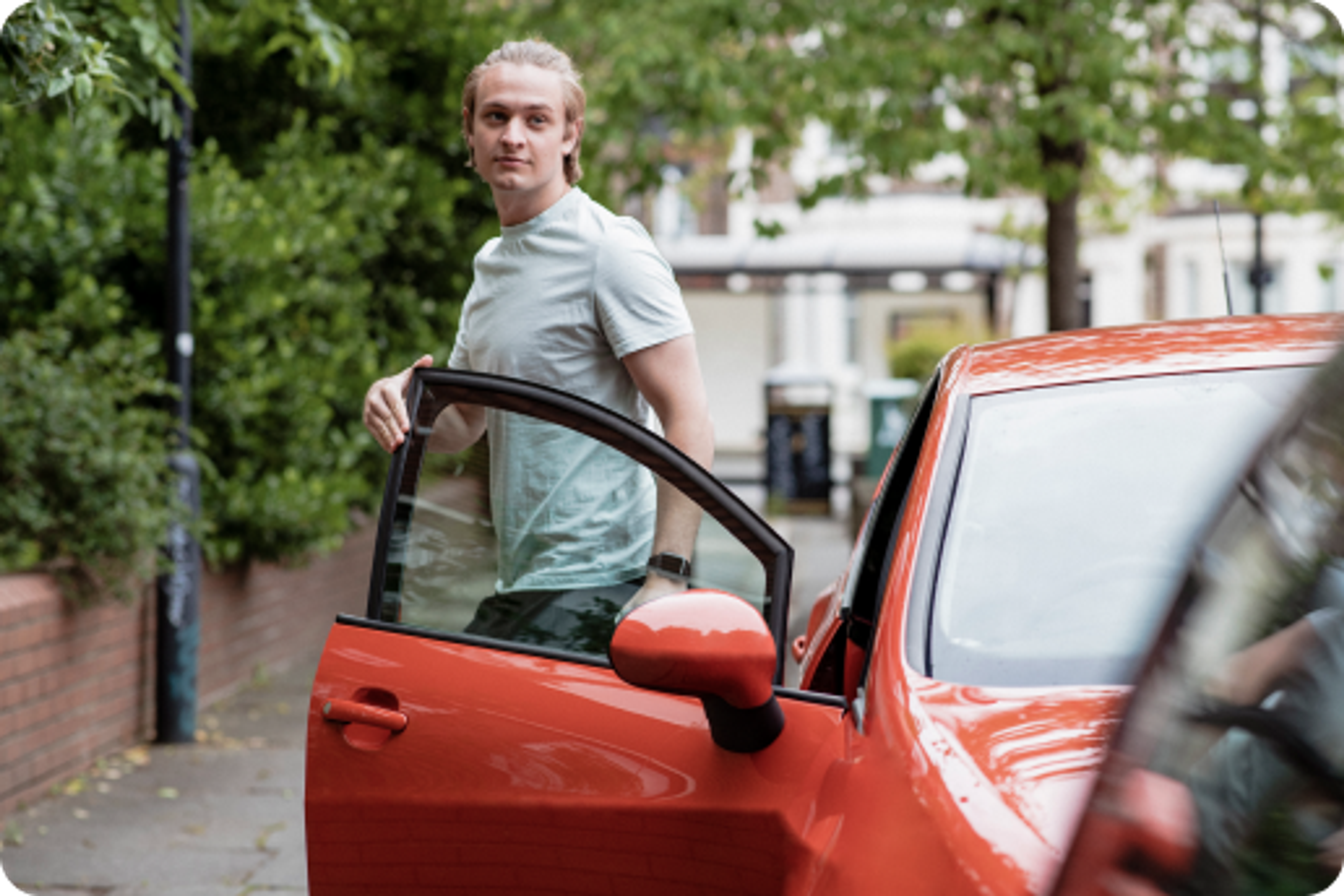 Zego new driver getting out of his zego insured car