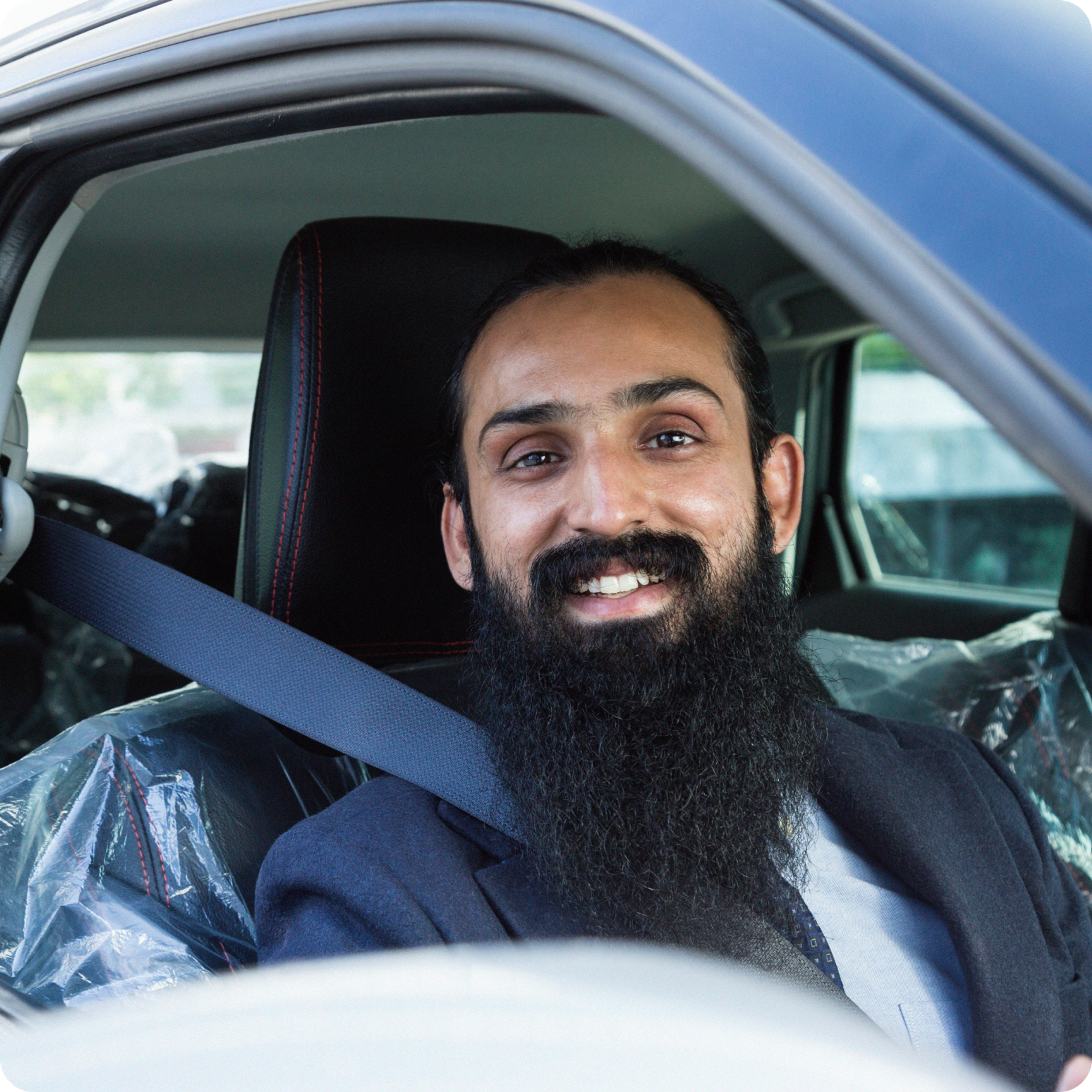 Smiling Zego scooter delivery rider and a smiling Zego car delivery driver