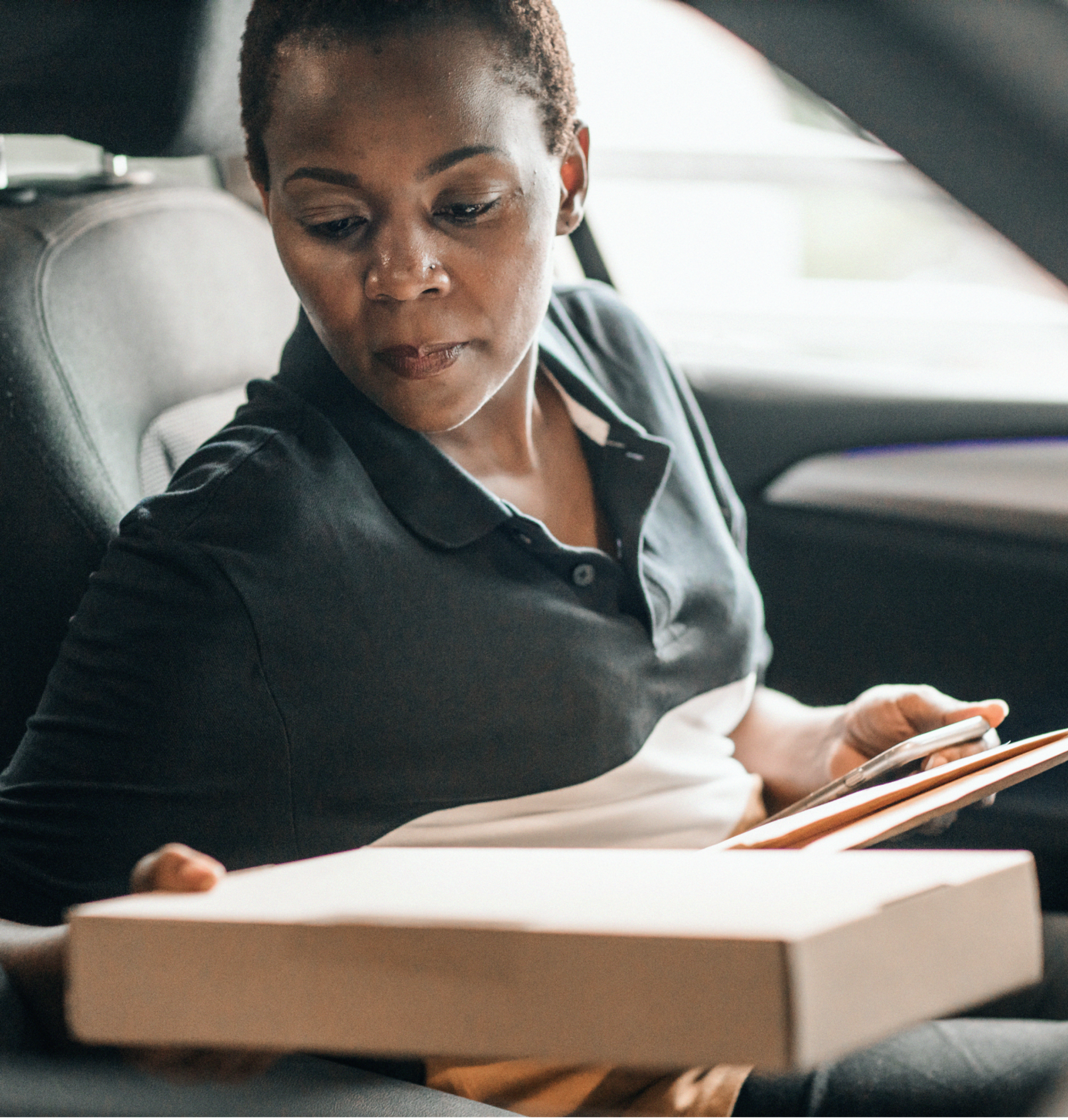 Zego car delivery driver loading parcels into the boot