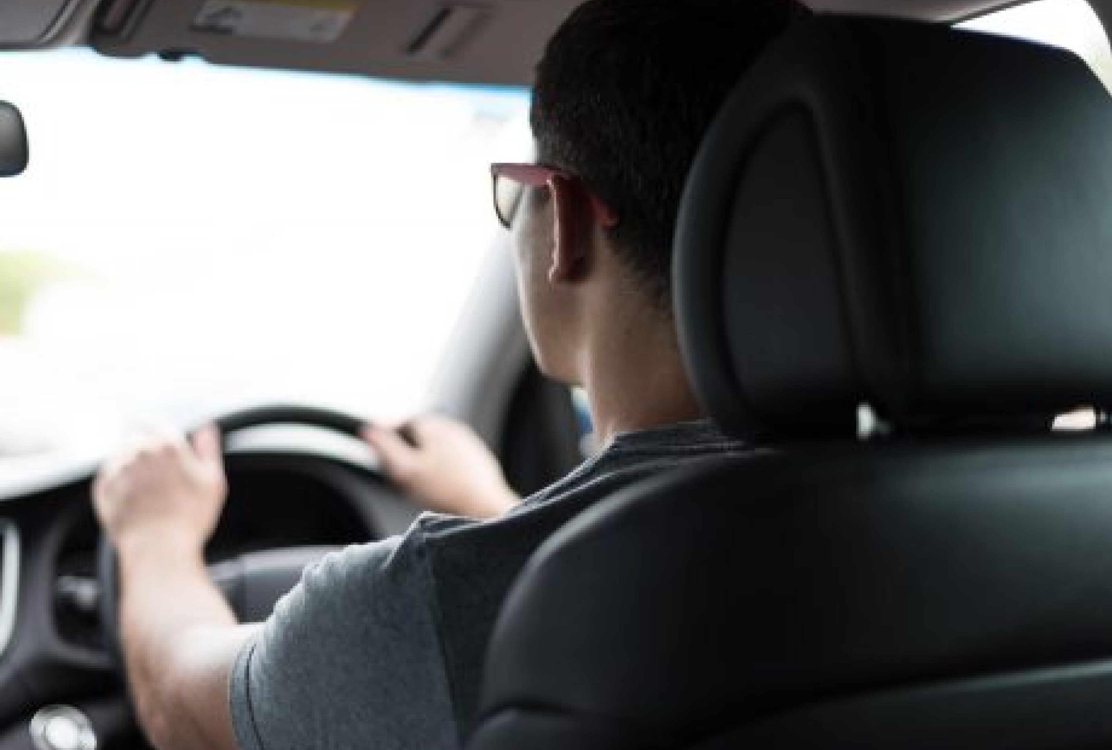 A new driver in his car on the road