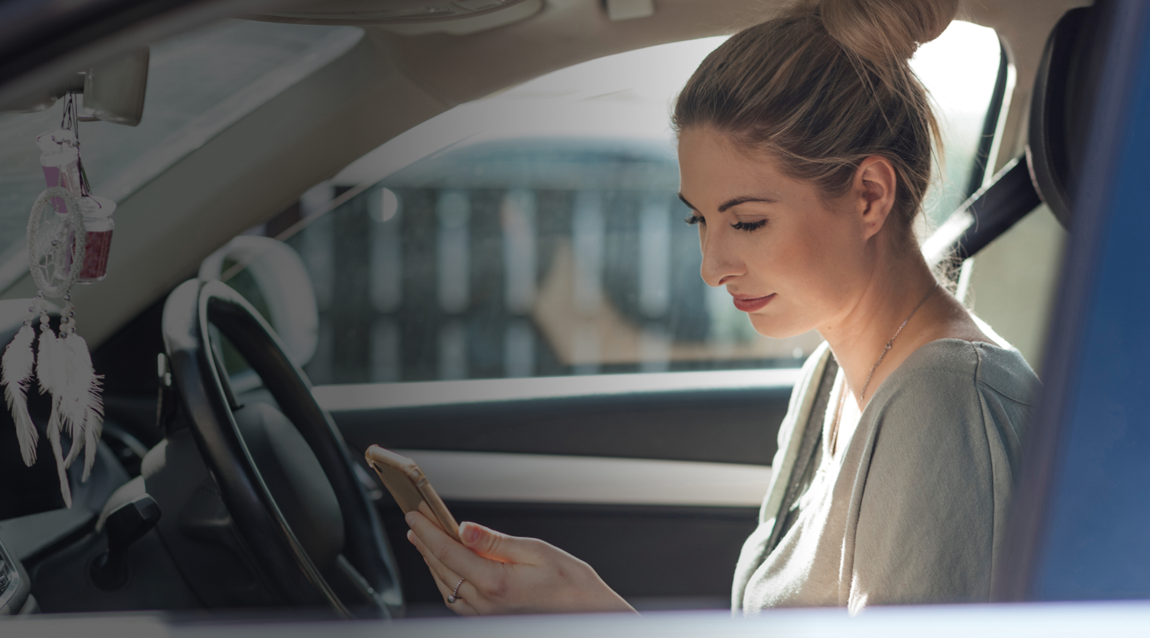 Zego new driver checking her zego sense driver score on her phone