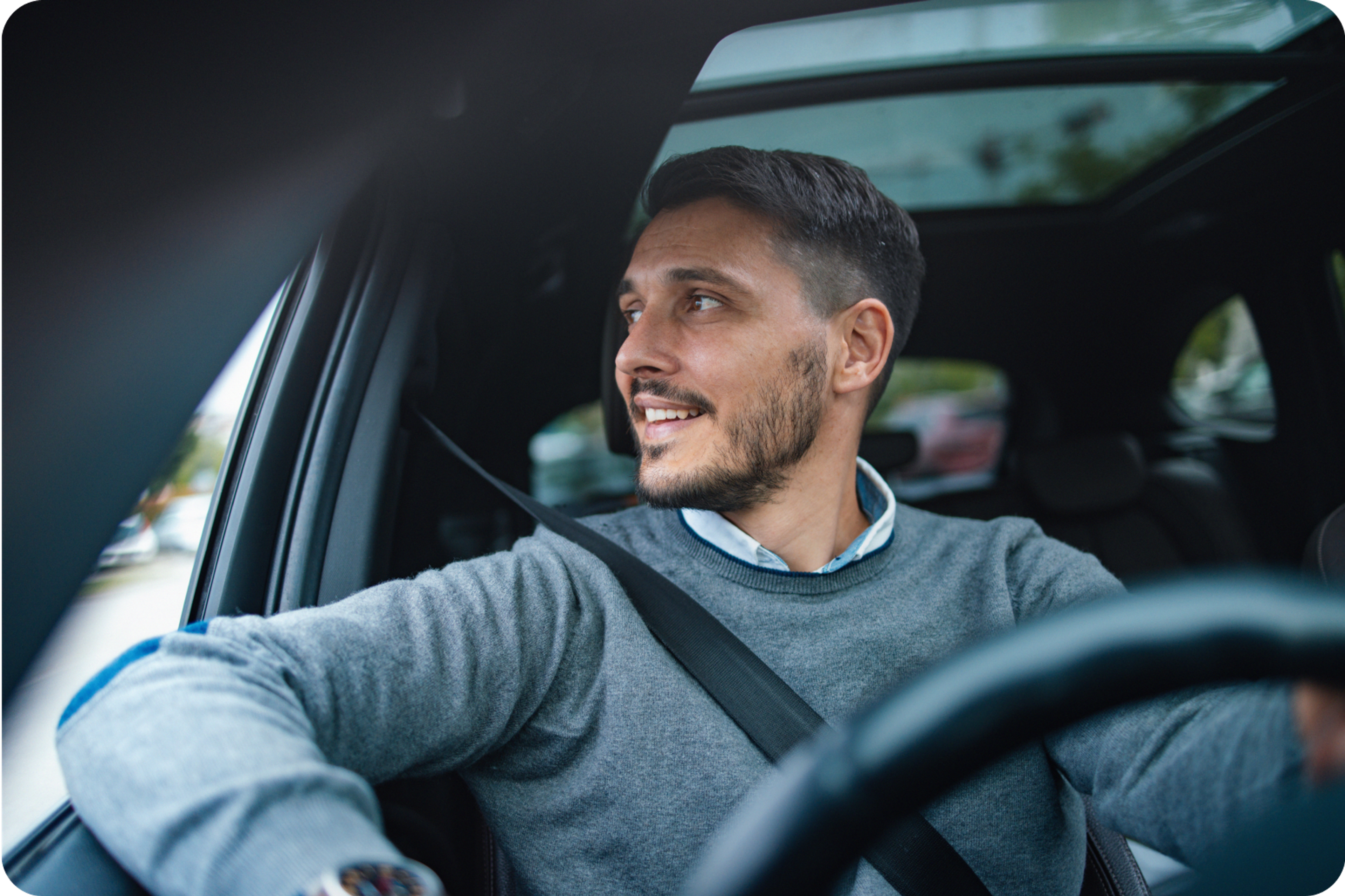 Smiling Zego private hire driver in his car