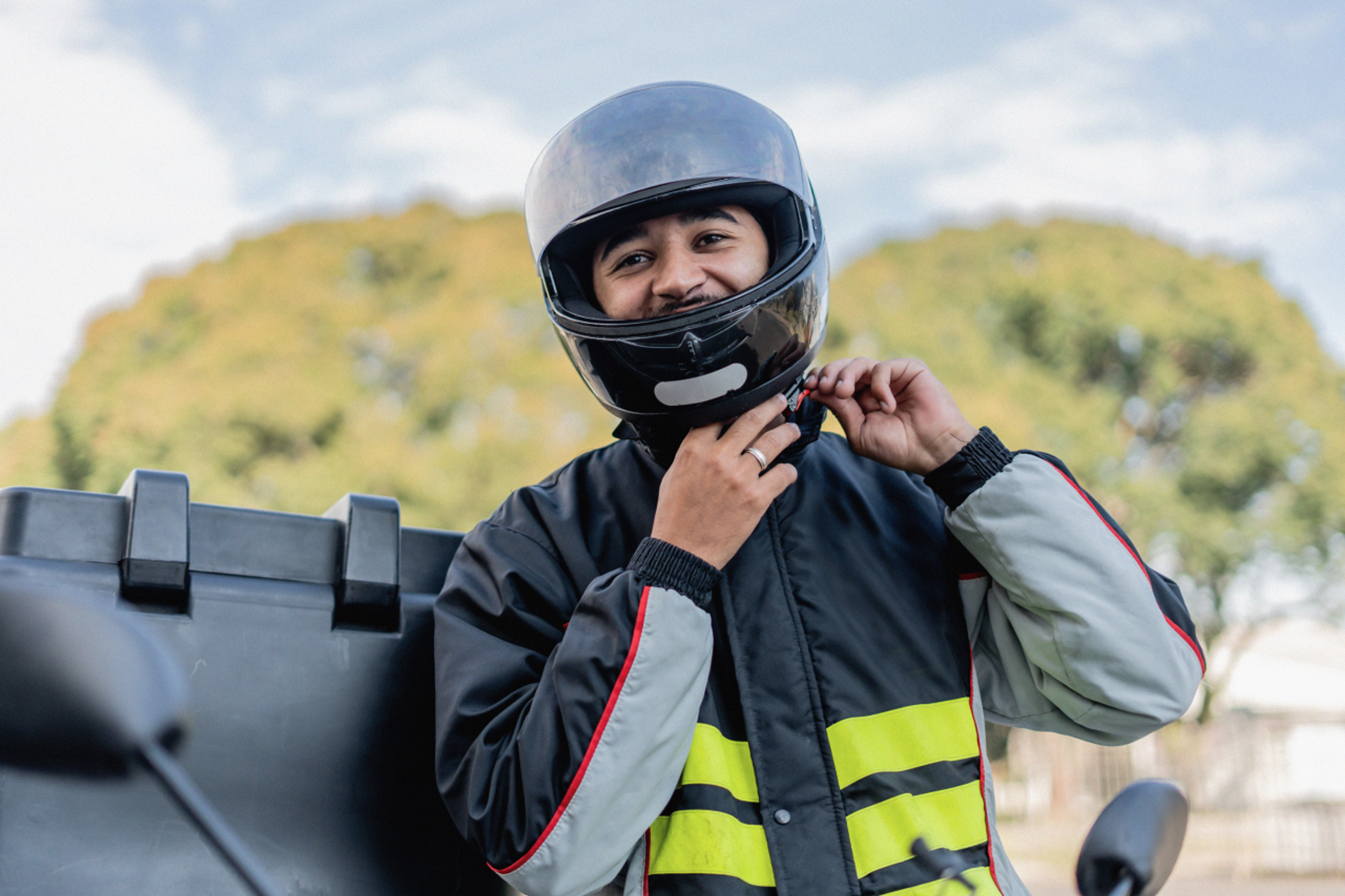 Delivery rider parked on the roadside