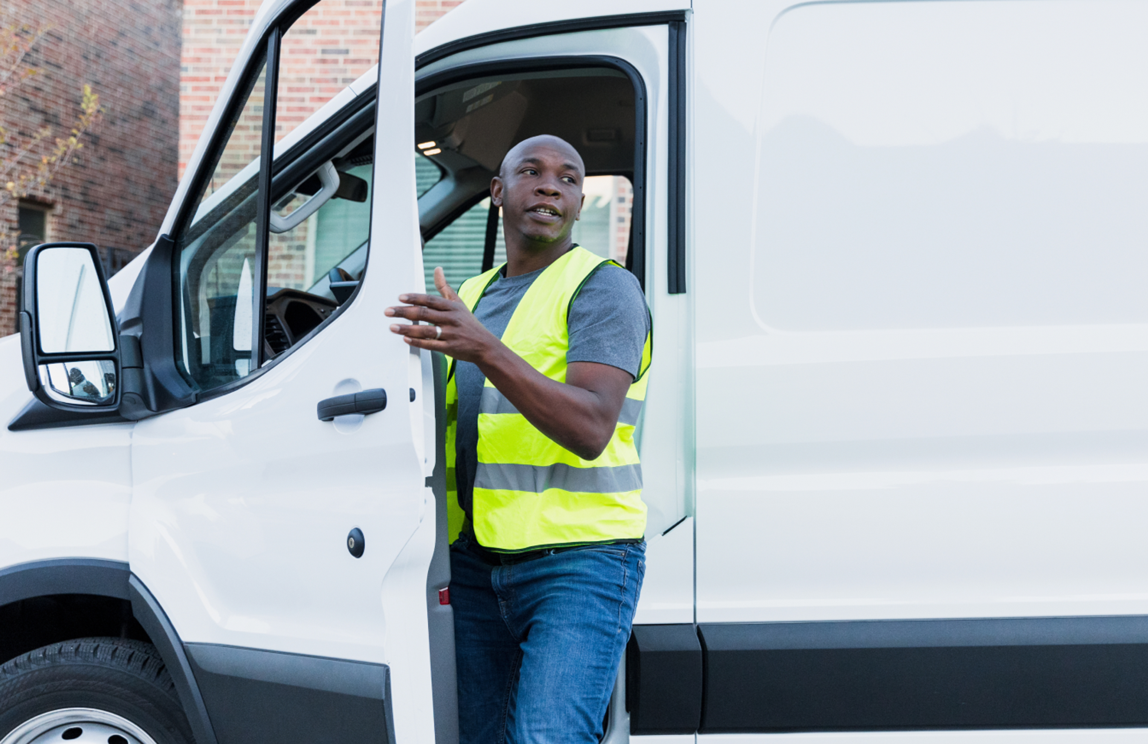 man getting out of a white van
