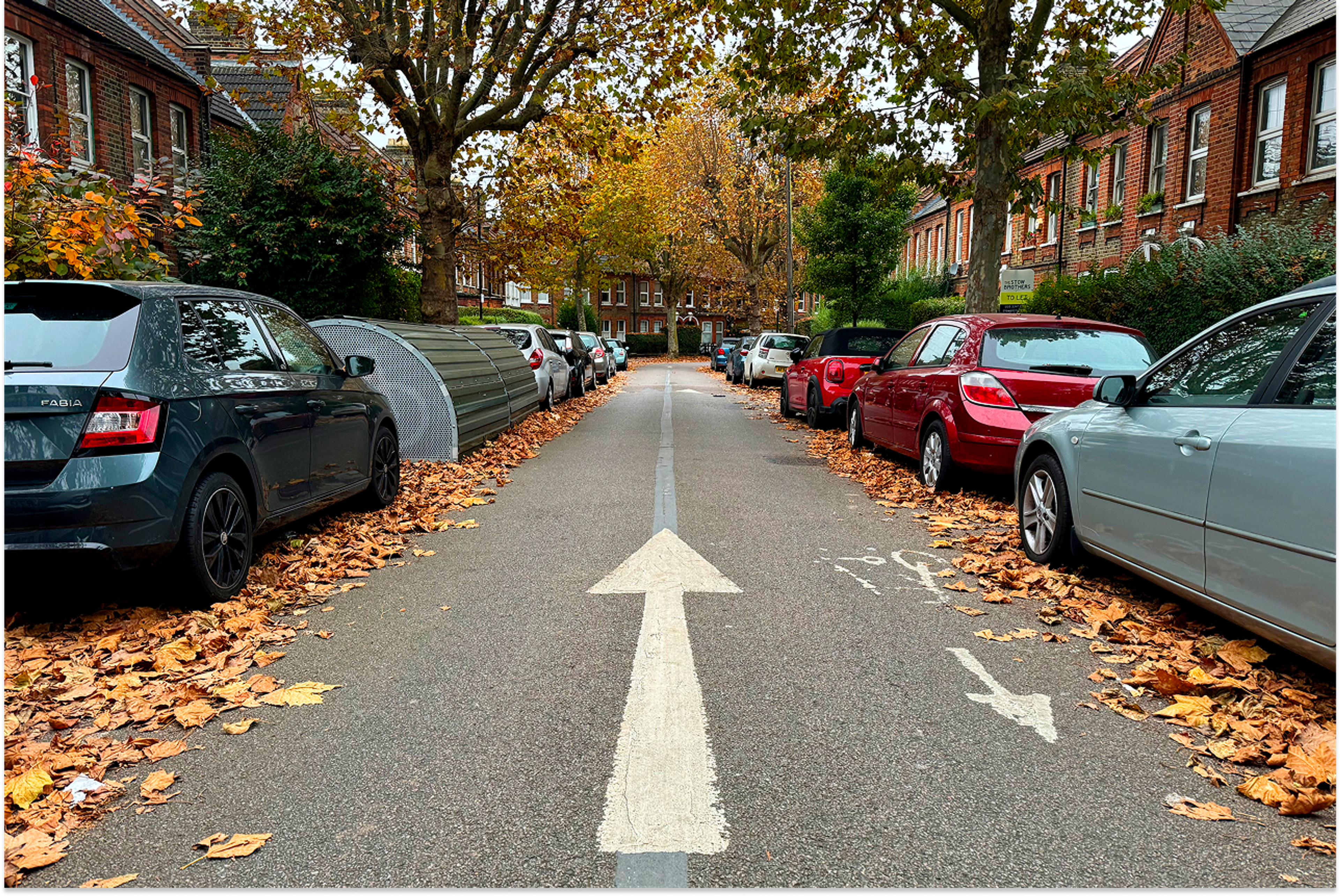 road in with parked cars on both sides