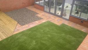 artificial grass with paving and patio