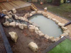 pond with water feature and decking