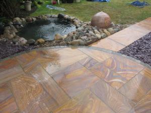 paving with pond and water feature
