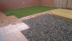 paving with artificial grass and patio