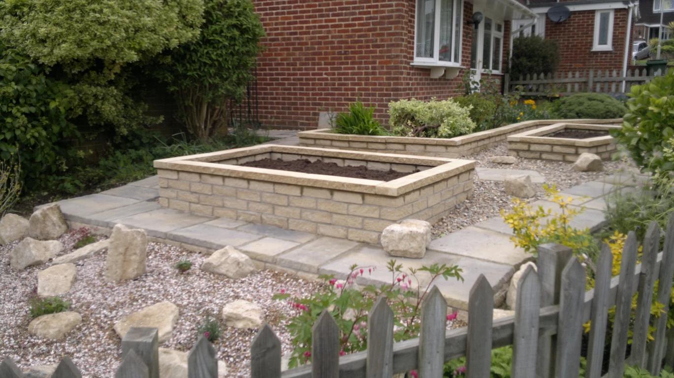 paving with brickwork planters
