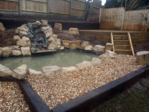 pond with water feature and gravel