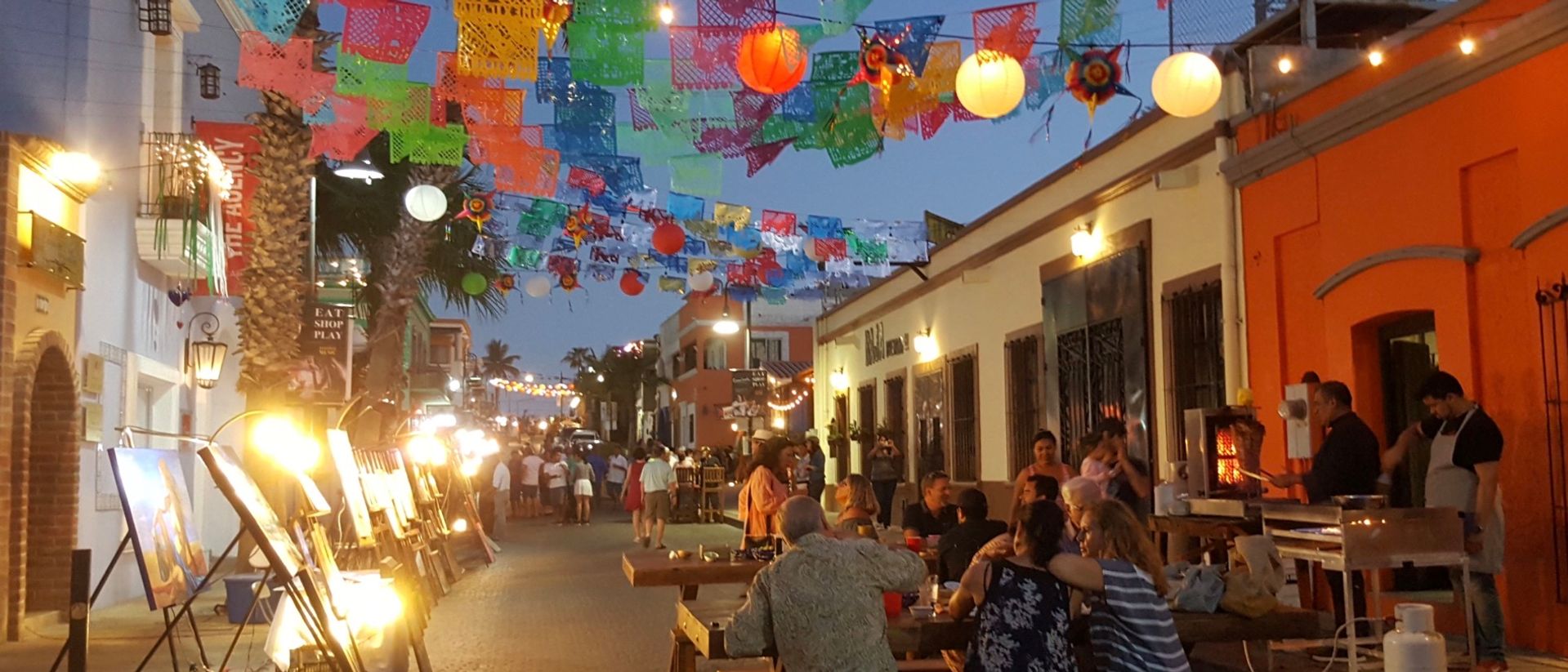 Colorful street in the San José del Cabo Gallery District during the weekly Art Walk with visitors and galleries