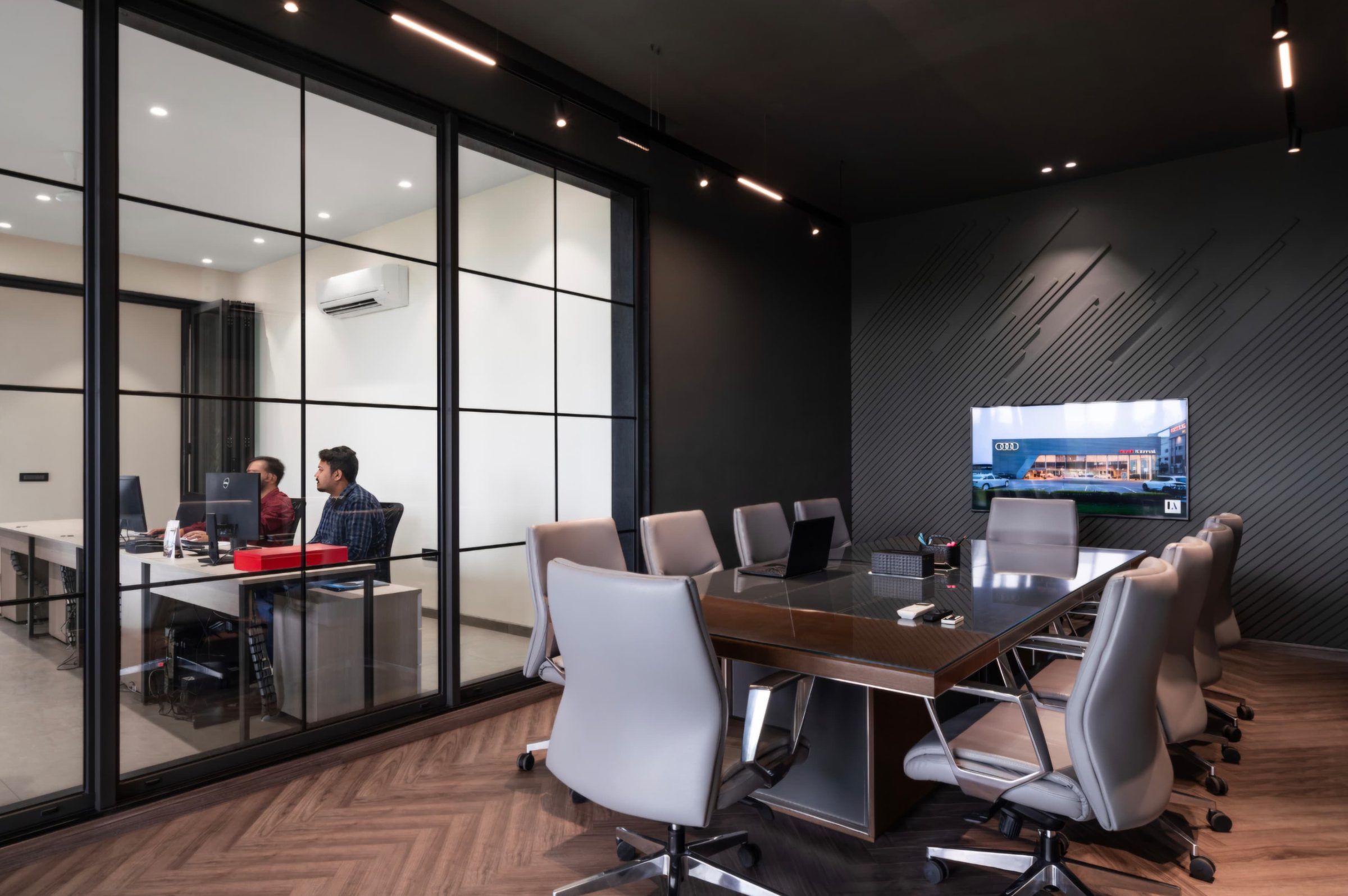 Conference room behind a gridded glass partition