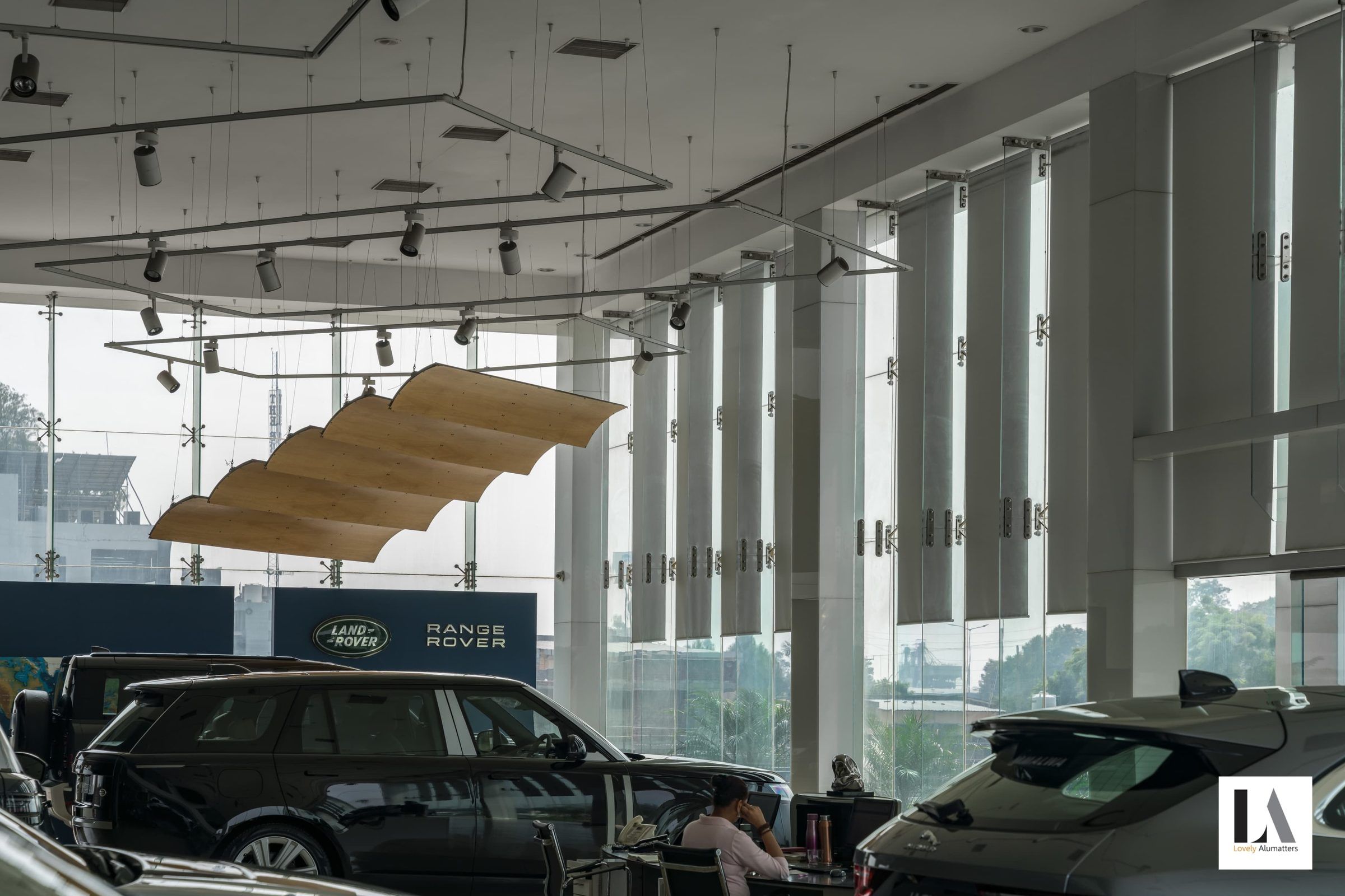 Showroom interior with tall glazing and vertical fins