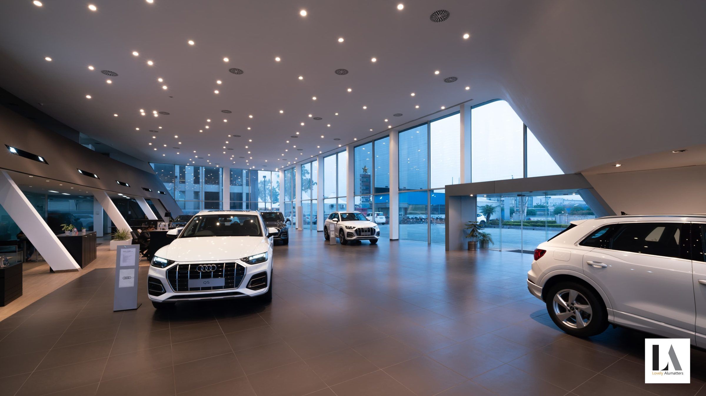 Showroom interior with floor-to-ceiling glazing along the display floor