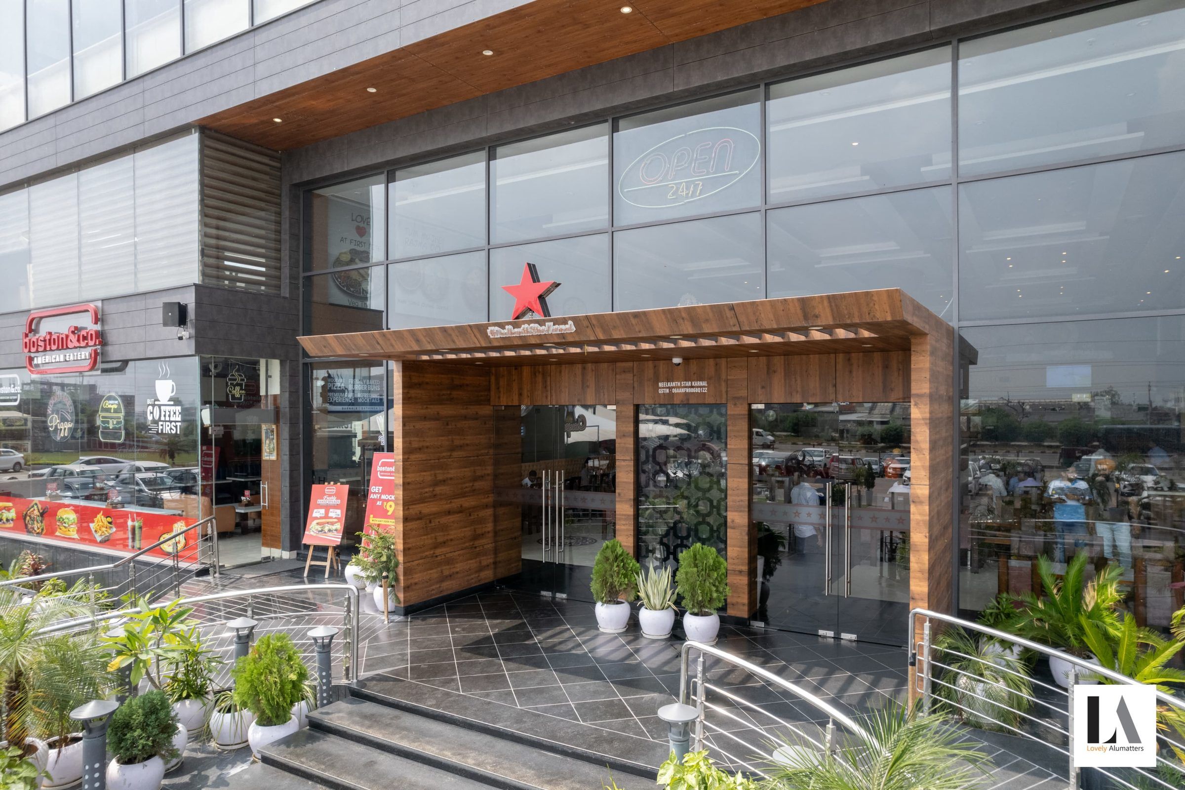 Timber-framed entrance set into a glass façade