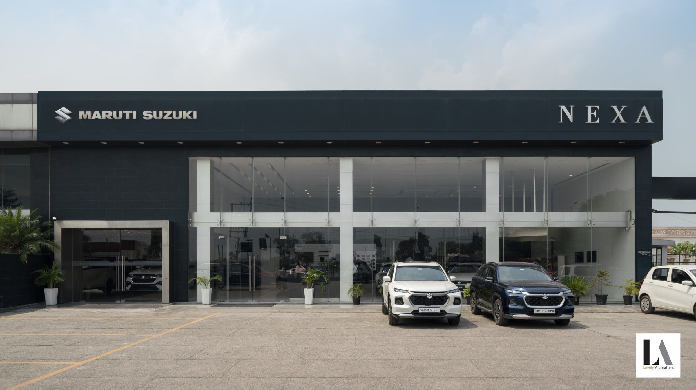 Two-storey showroom with a glazed frontage and dark metal fascia