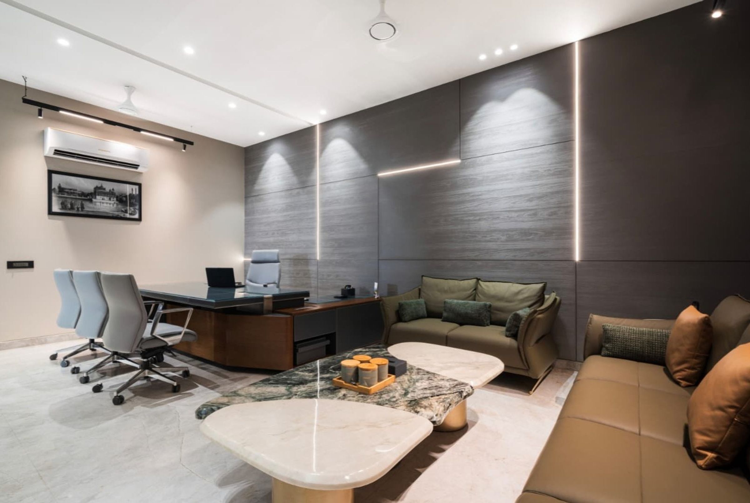 Office lounge with timber wall panelling and feature lighting