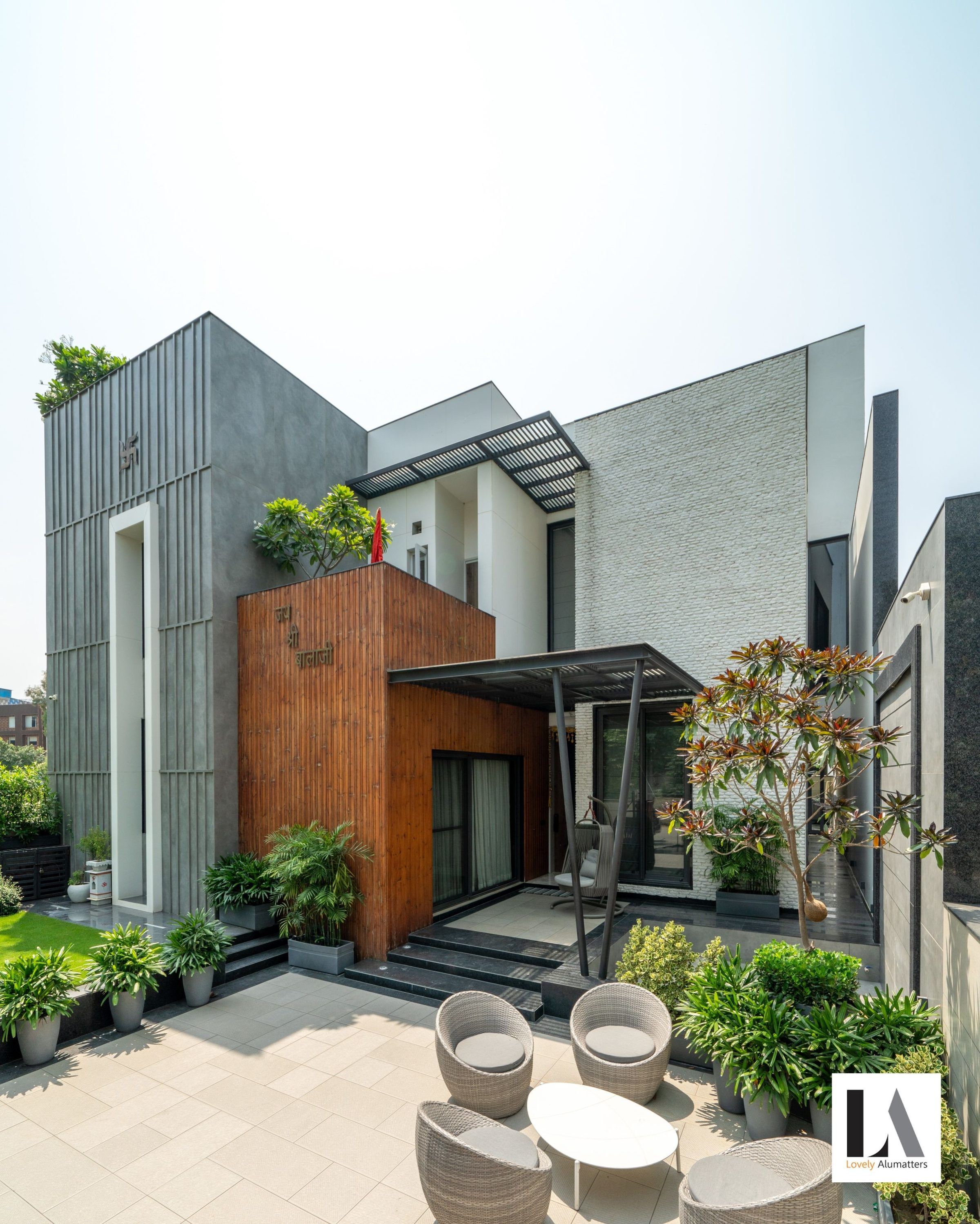 Courtyard view of the residence with timber, stone and glazed openings