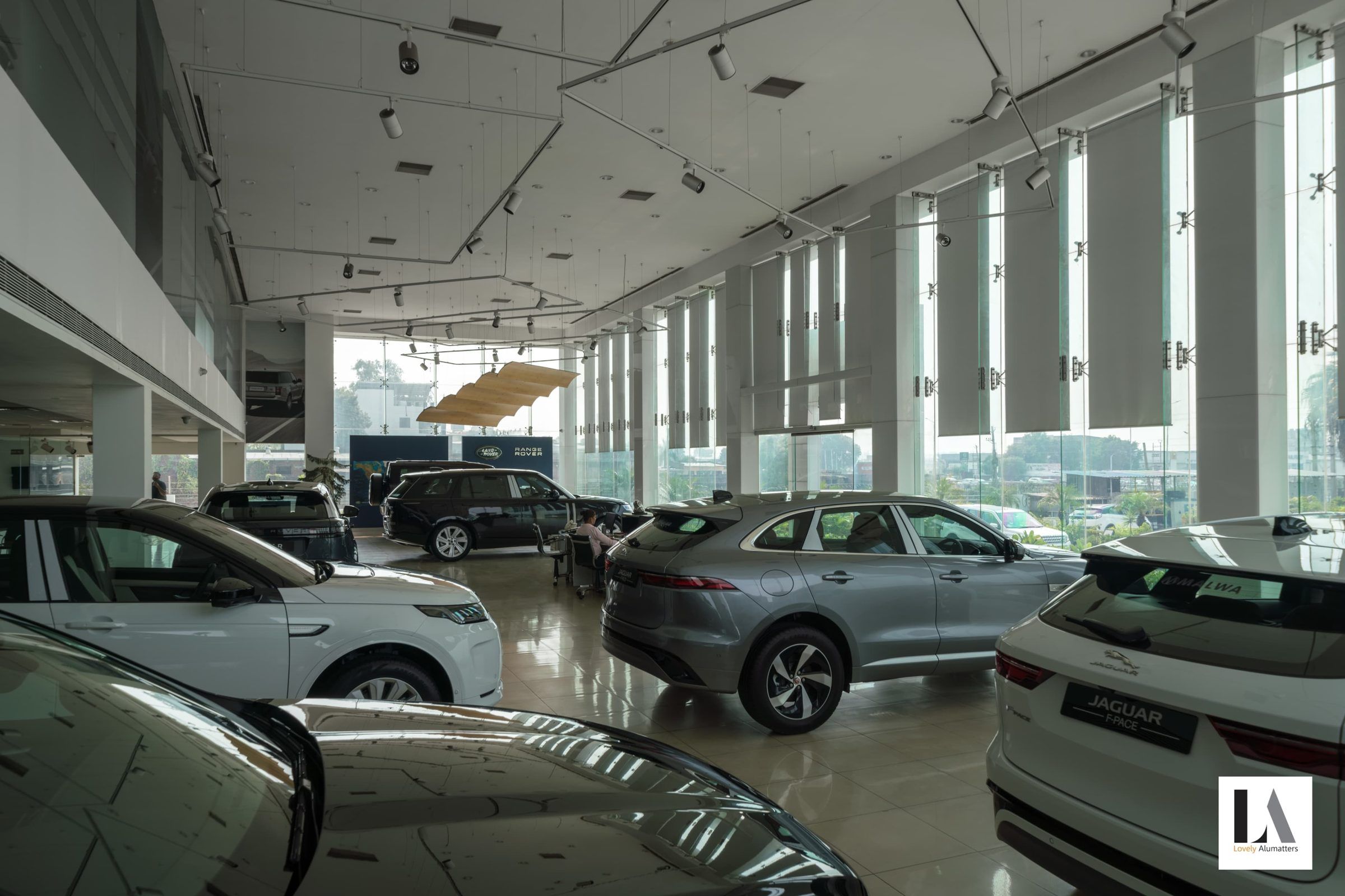 Display floor beside a run of tall glazed panels